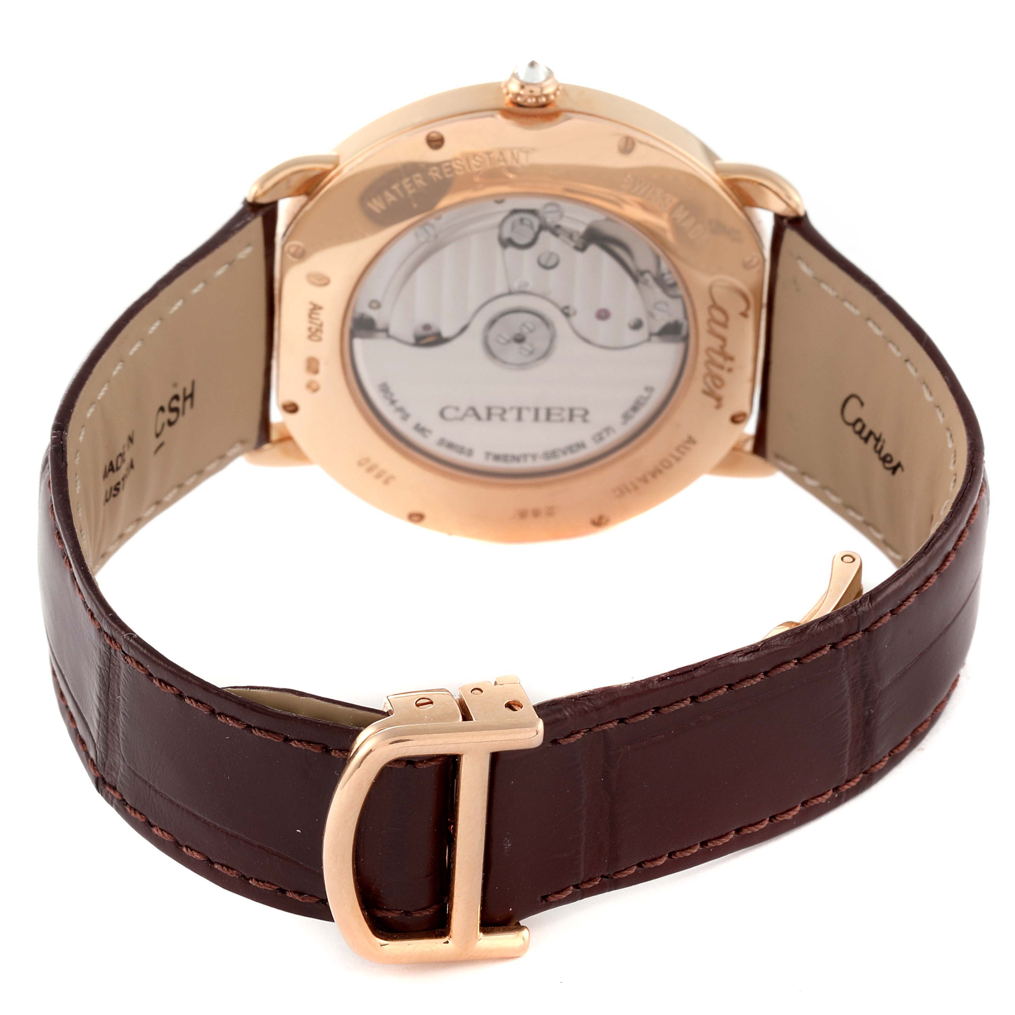 This Cartier Ronde WR007017 Men
s Rose Gold Silver Dial WR007017 Men
s Rose Gold Silver Dial watch is shown from the back, displaying its transparent case back and brown leather strap with a gold buckle.