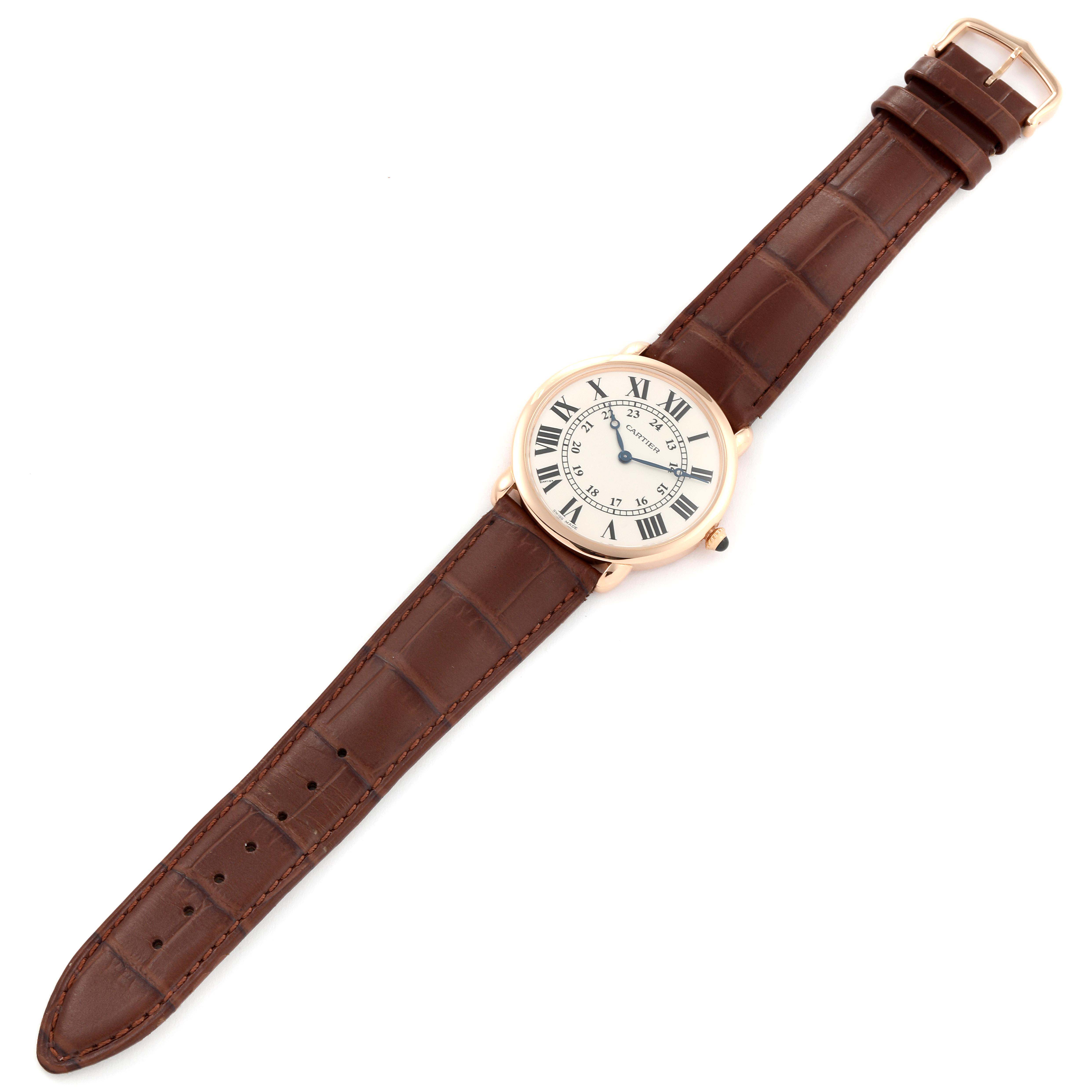 The image shows a top-down view of the Cartier Ronde W6800251 Men's Rose Gold Silver Dial W6800251 Men's Rose Gold Silver Dial watch with a brown leather strap and a white dial with Roman numerals.