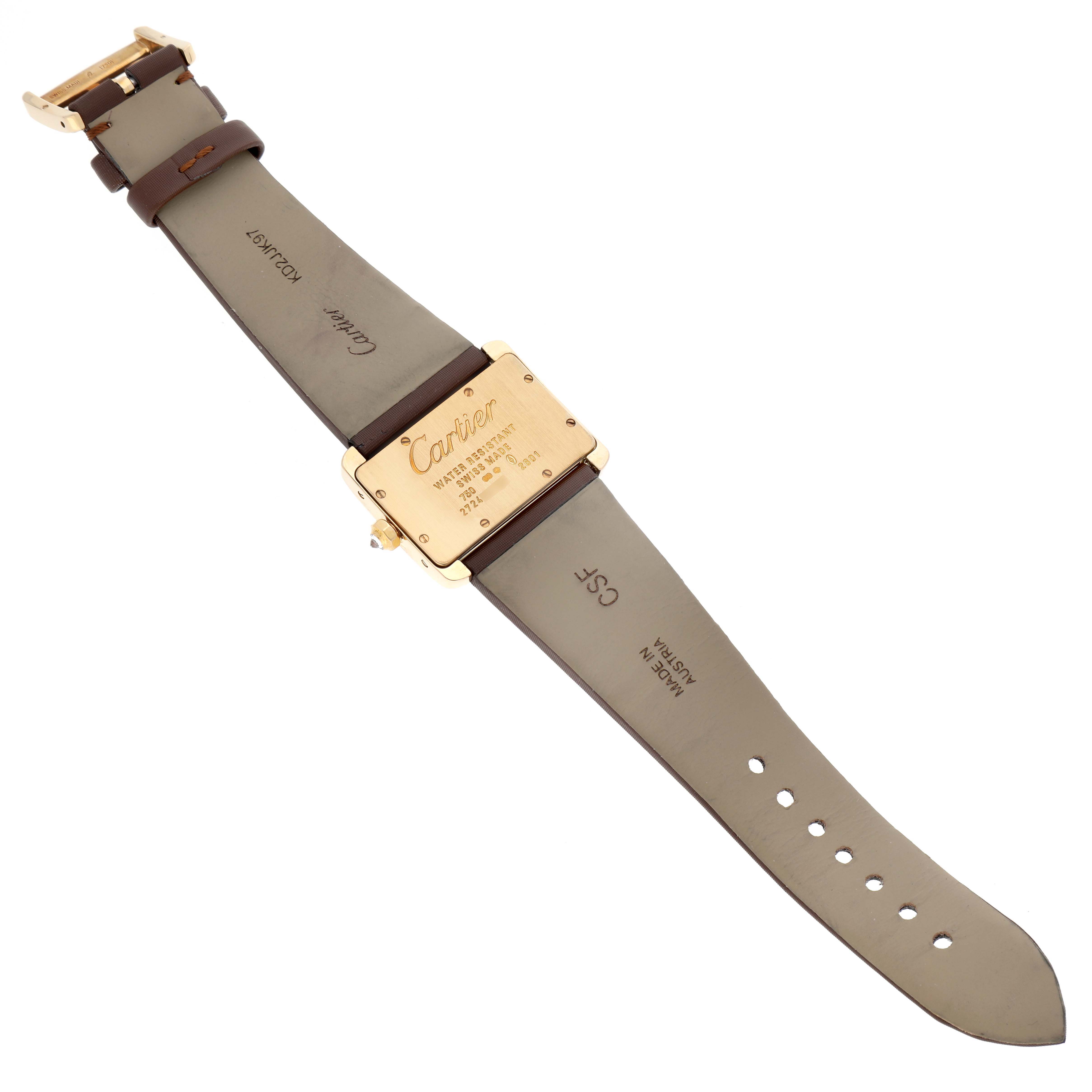 The image shows the back view of the Cartier Tank Divan WA301071 Women
s Yellow Gold Silver Dial WA301071 Women
s Yellow Gold Silver Dial watch, displaying the case back and leather strap fully extended.