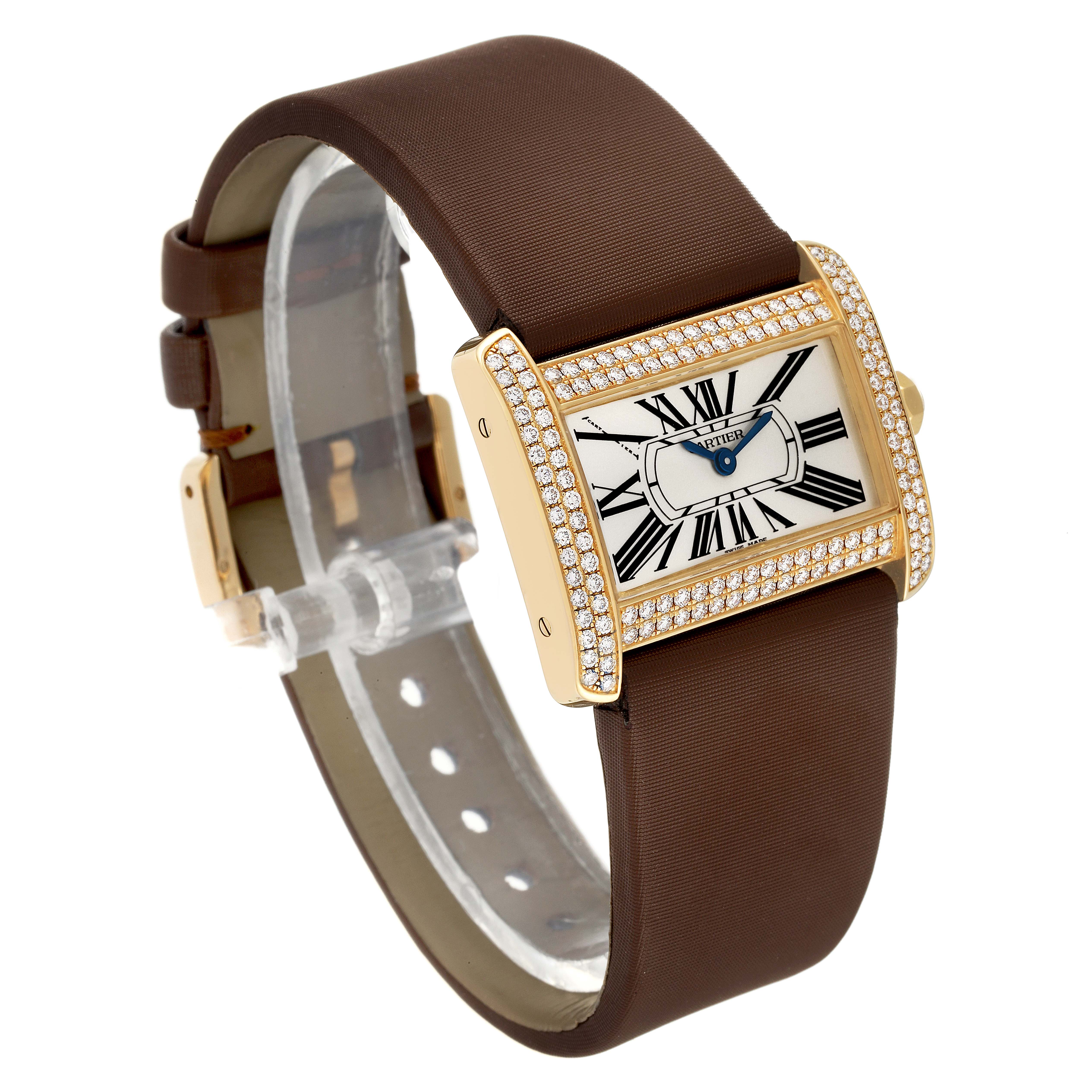 The Cartier Tank Divan WA301071 Women
s Yellow Gold Silver Dial WA301071 Women
s Yellow Gold Silver Dial watch is displayed at an angle showing its face, case, strap, and bejeweled bezel.