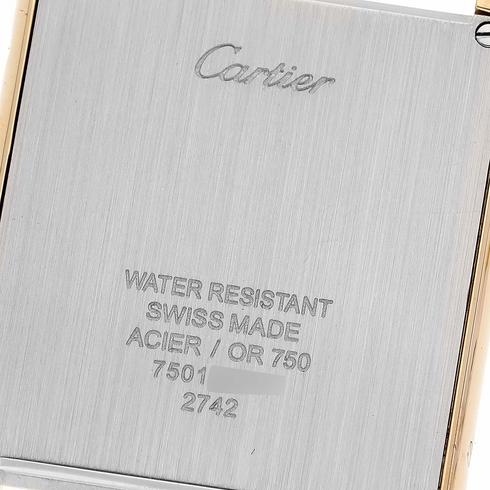 This image shows the back case of a Cartier Tank Solo W1018855 Men
s Steel and Gold (two tone) Silver Dial W1018855 Men
s Steel and Gold (two tone) Silver Dial watch, highlighting the brand name and technical specifications.