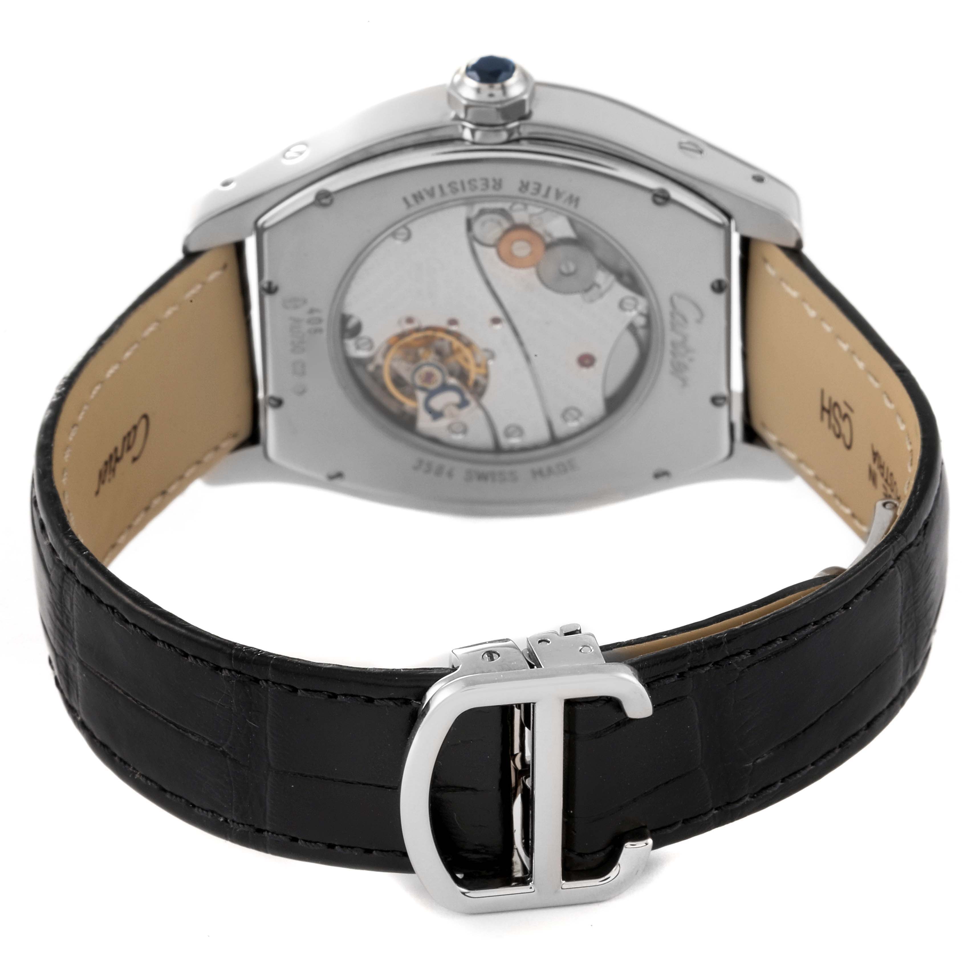 The image shows the back view of a Tortue model by Cartier, highlighting the movement mechanism and leather strap with a buckle clasp.