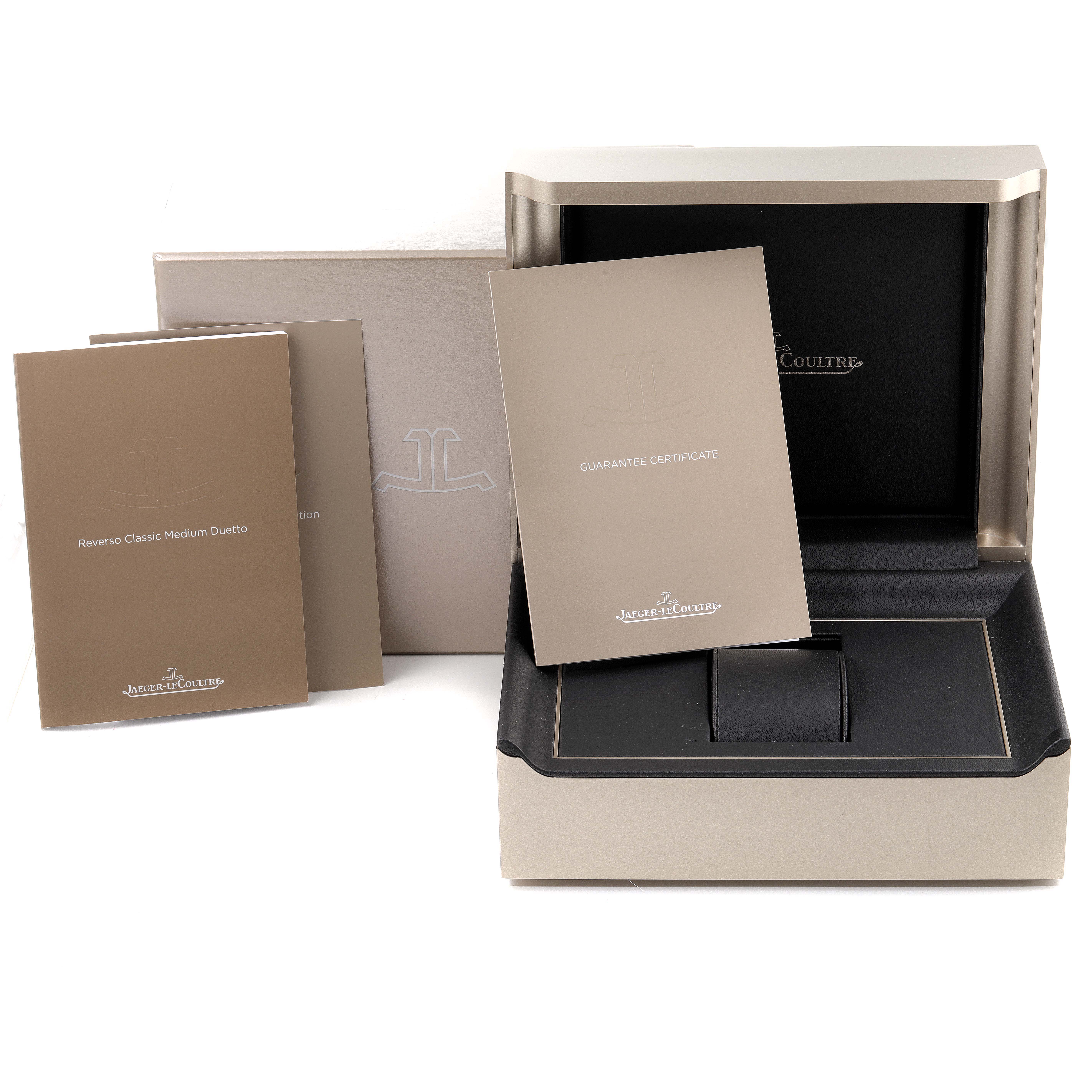 The image shows the packaging and documentation for a Jaeger LeCoultre Reverso Q2578420 Women's Stainless Steel Black Dial Q2578420 Women's Stainless Steel Black Dial watch, including a case and guarantee certificate.