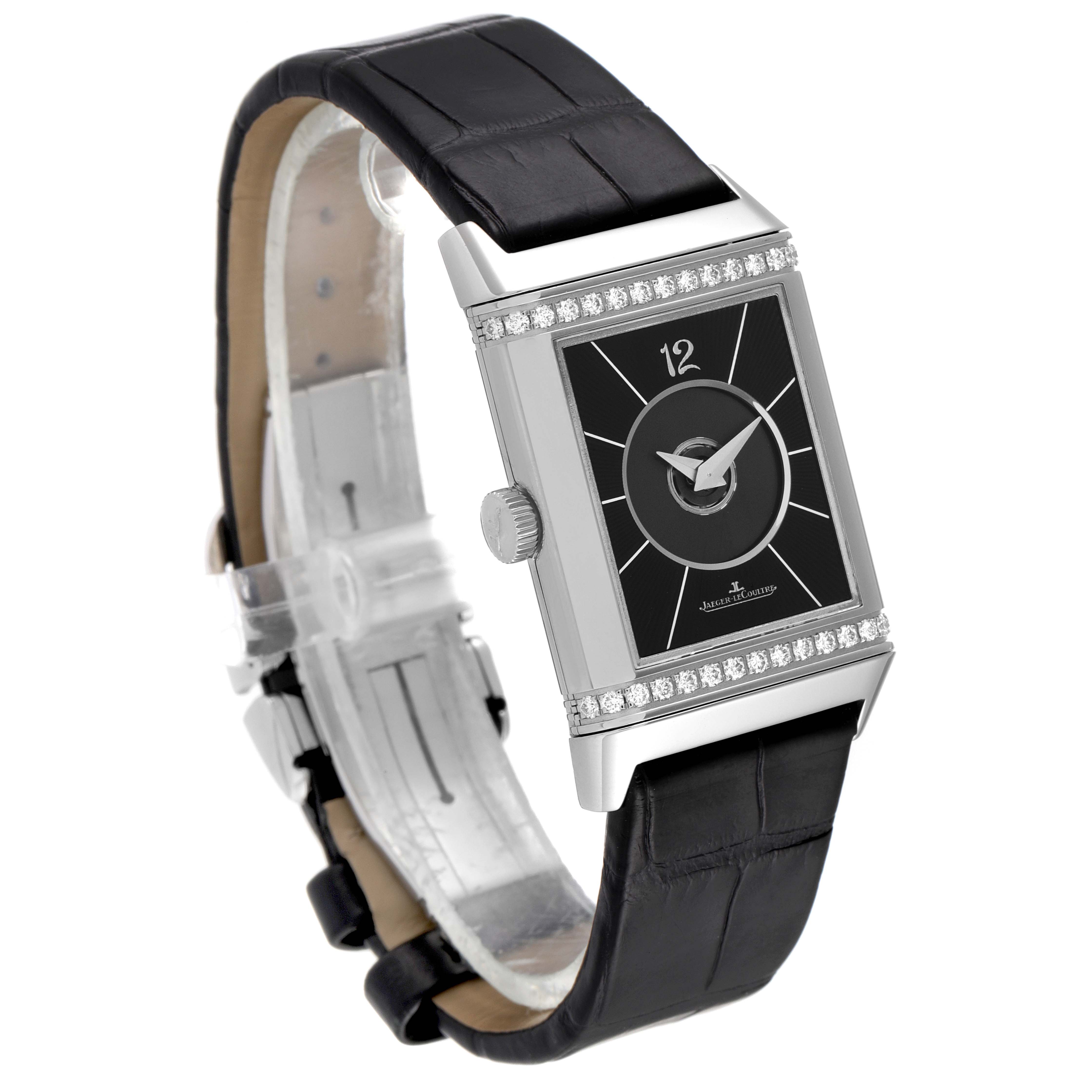 The image shows a Jaeger-LeCoultre Reverso watch angled to display the face, crown, and black leather strap.