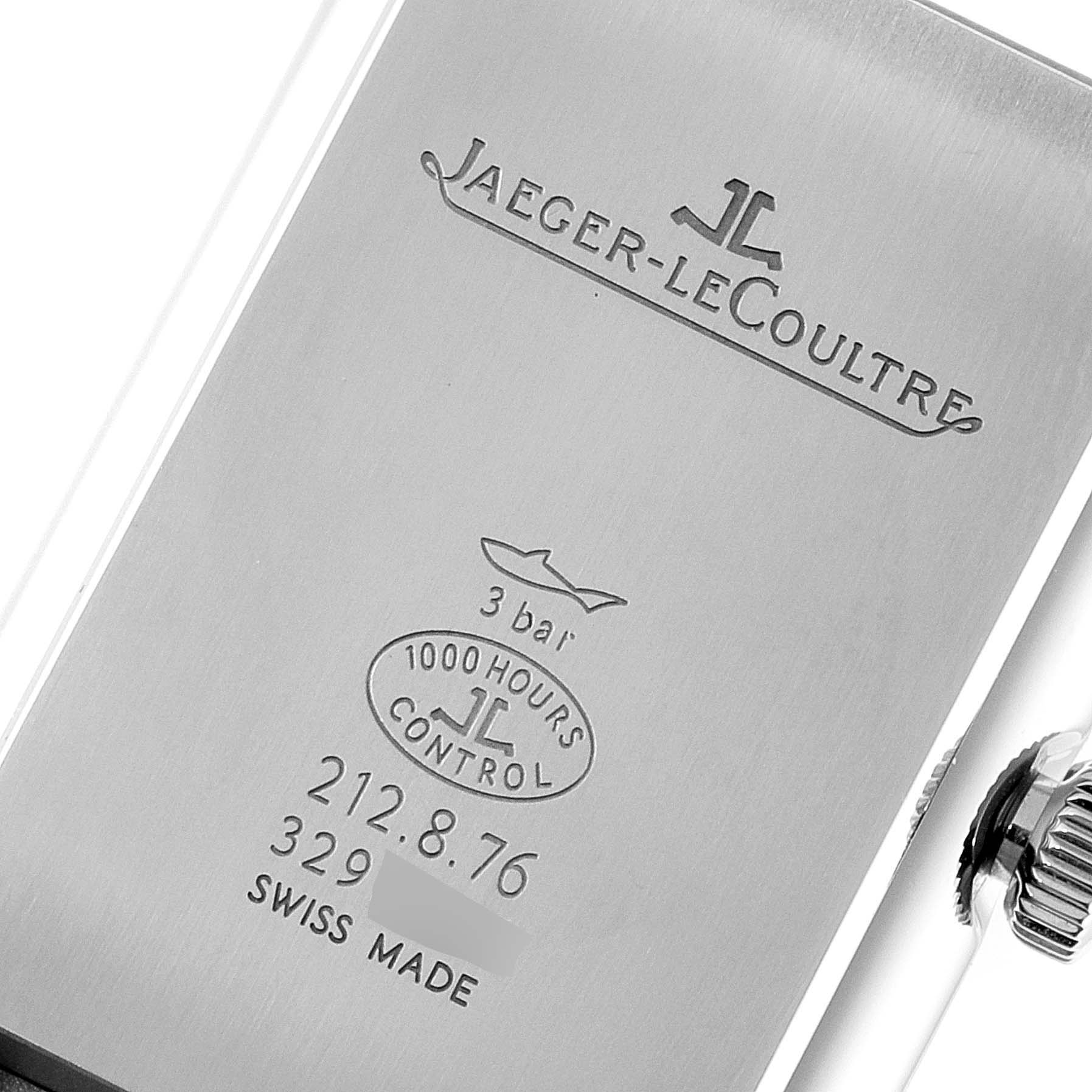This image shows the engraved back and crown of a Jaeger-LeCoultre Reverso watch.