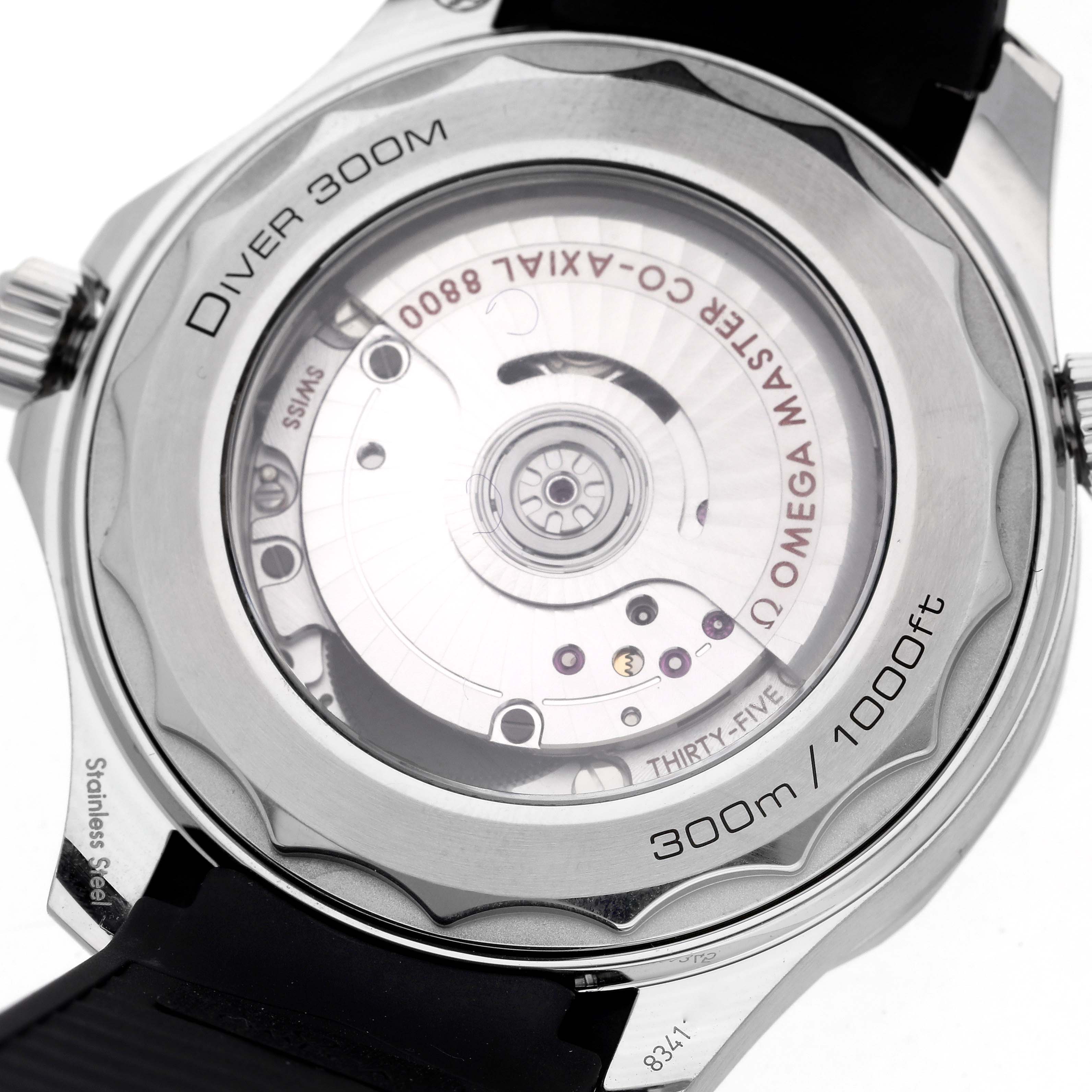 The image shows the back case of an Omega Seamaster 210.32.42.20.04.001 Men's Stainless Steel White Dial 210.32.42.20.04.001 Men's Stainless Steel White Dial, highlighting the movement and "Diver 300M" engraving.