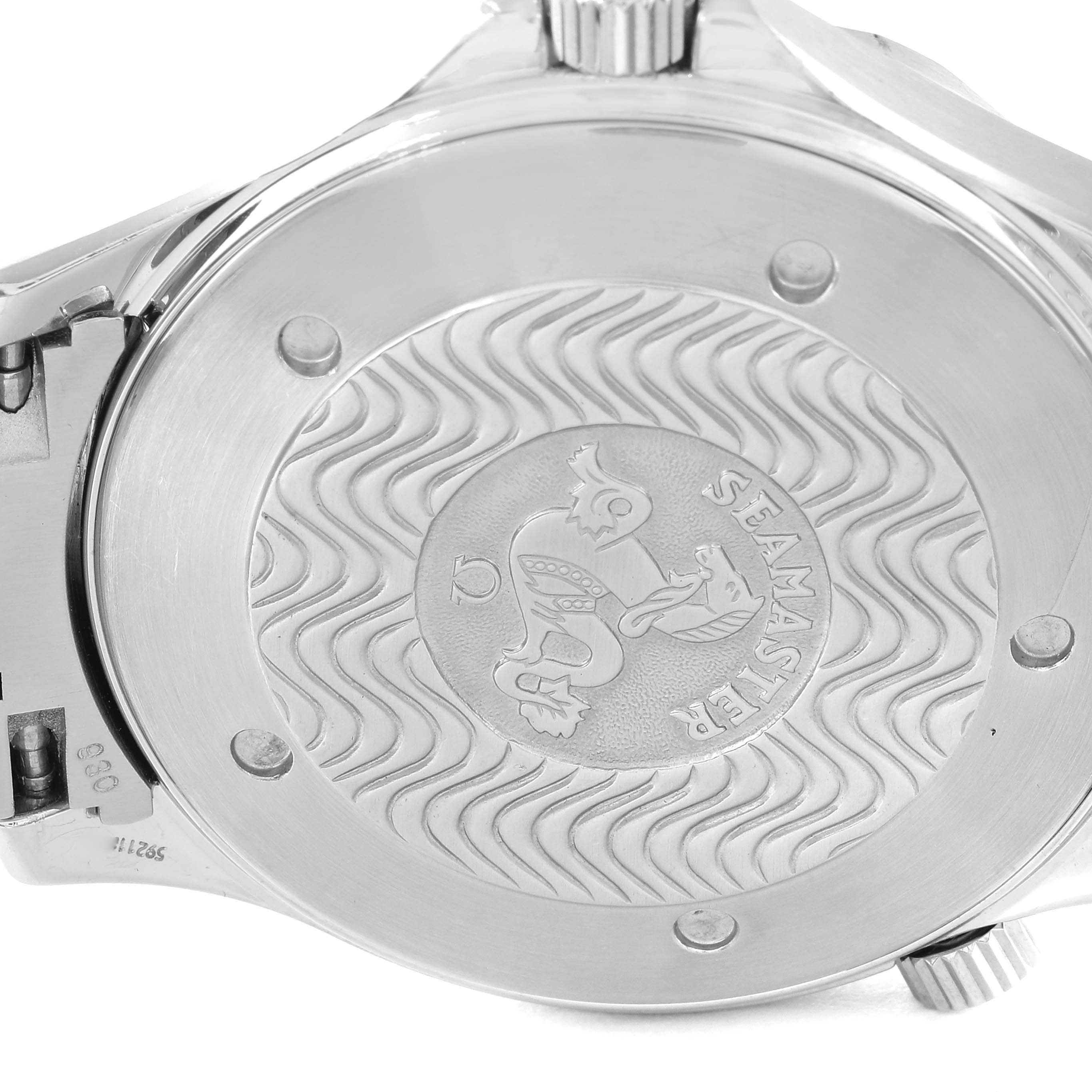 The image shows the back case of an Omega Seamaster 2265.80.00 Men's Stainless Steel Blue Dial 2265.80.00 Men's Stainless Steel Blue Dial watch with the emblem and wave pattern engraved.