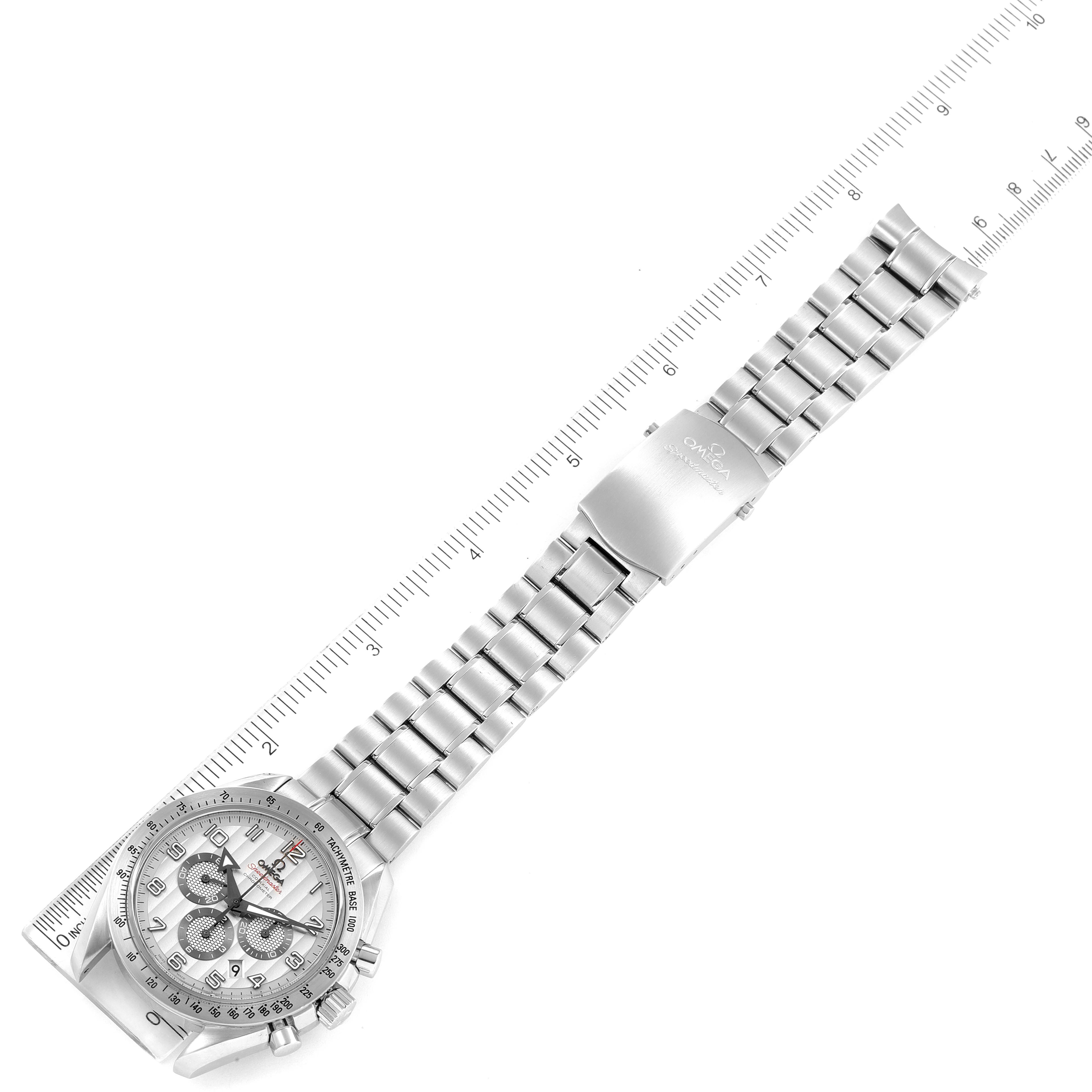 The image shows an Omega Speedmaster 321.10.44.50.02.001 Men
s Stainless Steel Silver Dial 321.10.44.50.02.001 Men
s Stainless Steel Silver Dial watch laid flat, showcasing its bracelet, clasp, and dial with surrounding ruler measurements.