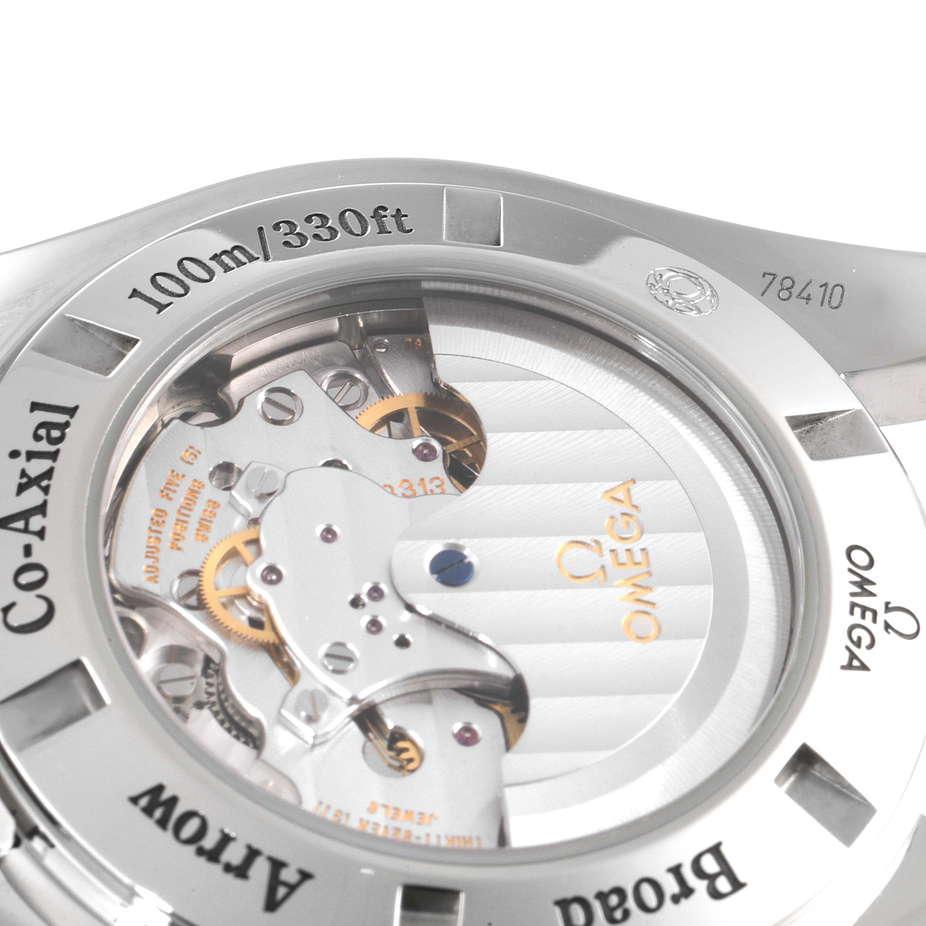 The image shows the back of the Omega Speedmaster 321.10.44.50.02.001 Men
s Stainless Steel Silver Dial 321.10.44.50.02.001 Men
s Stainless Steel Silver Dial, highlighting its co-axial movement and water resistance details.