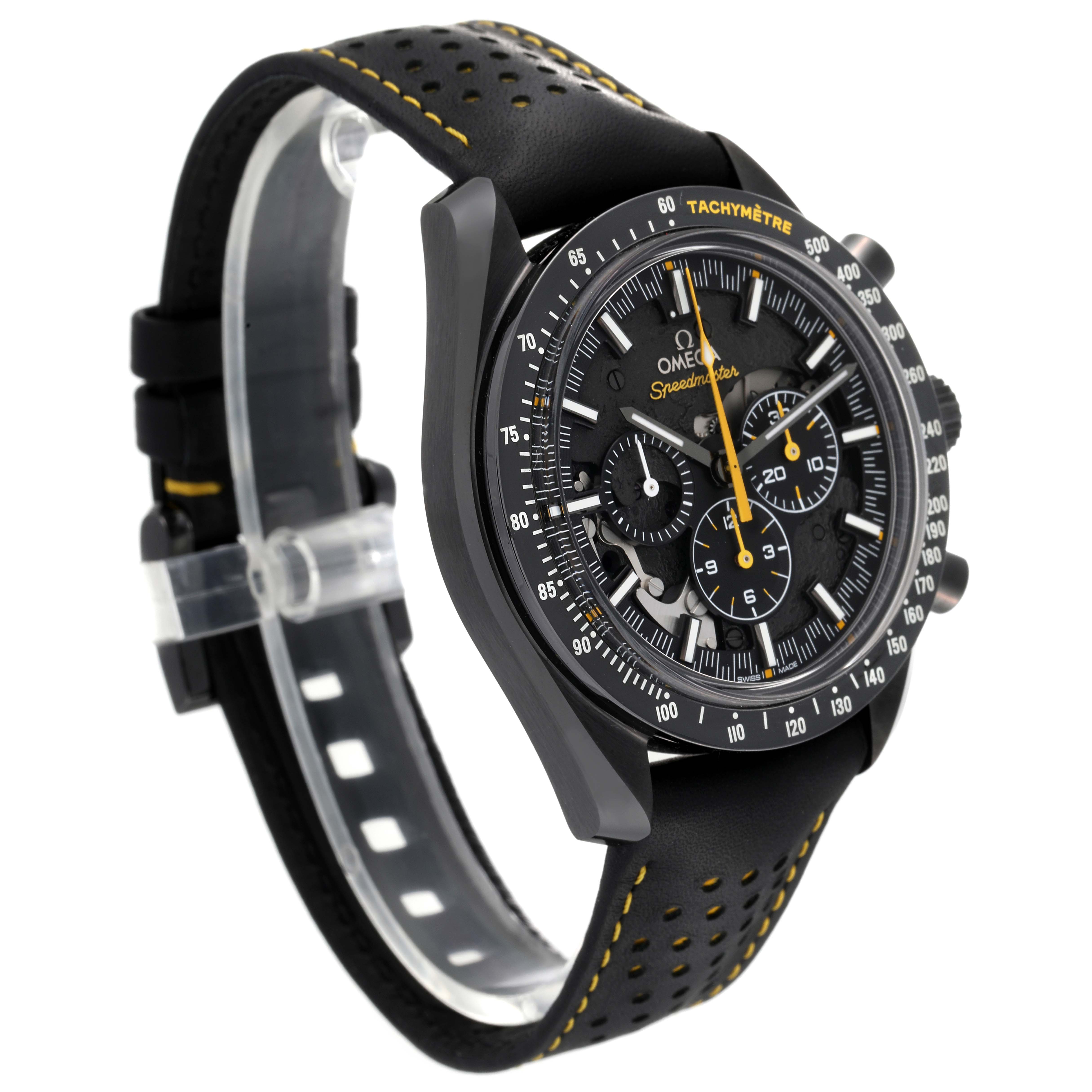 This Omega Speedmaster 311.92.44.30.01.001 Men's Ceramic Black Dial 311.92.44.30.01.001 Men's Ceramic Black Dial watch is shown at an angle, highlighting its black case, tachymeter bezel, and perforated black strap with yellow stitching.