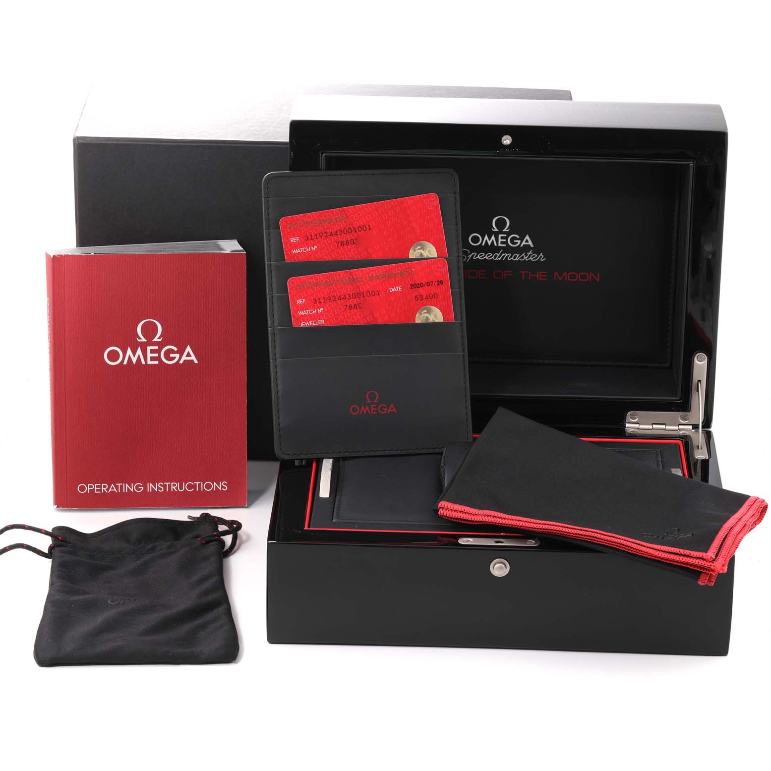 The image shows Omega Speedmaster 311.92.44.30.01.001 Men's Ceramic Black Dial 311.92.44.30.01.001 Men's Ceramic Black Dial accessories including the box, instructions, warranty cards, and pouches.