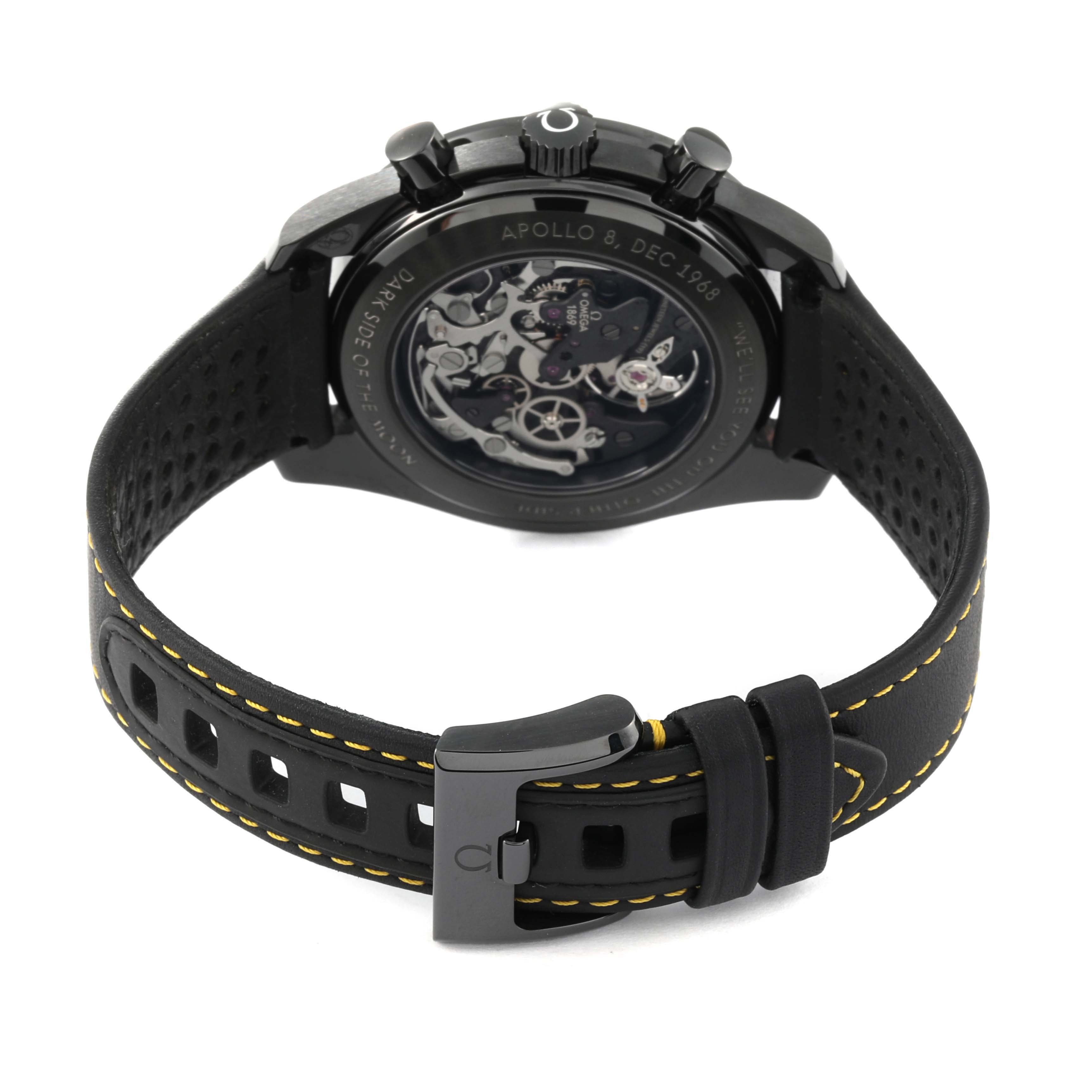 This image shows the back view of the Omega Speedmaster 311.92.44.30.01.001 Men's Ceramic Black Dial 311.92.44.30.01.001 Men's Ceramic Black Dial, highlighting the movement and perforated strap with yellow stitching.