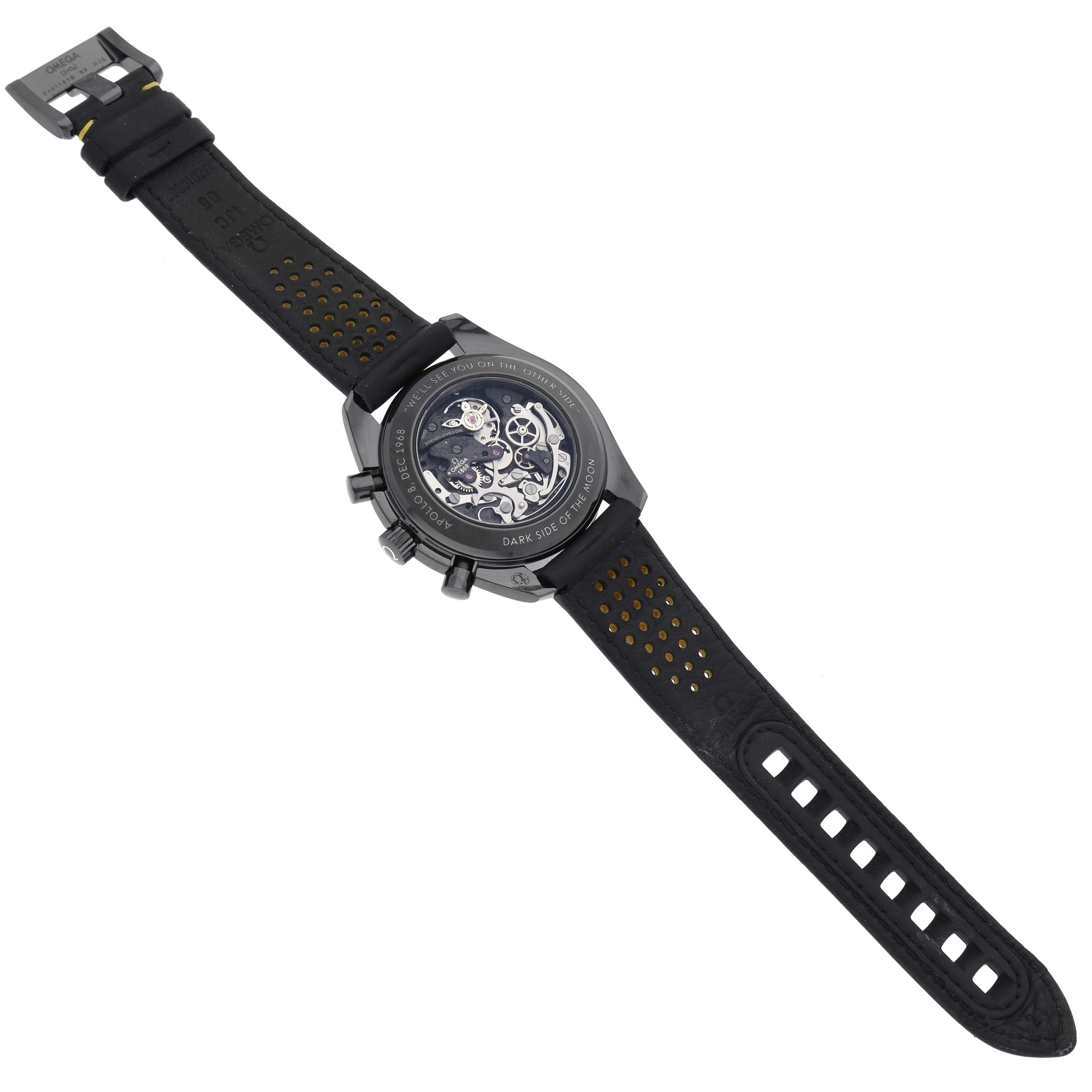 The image shows the back view of an Omega Speedmaster 311.92.44.30.01.001 Men's Ceramic Black Dial 311.92.44.30.01.001 Men's Ceramic Black Dial watch, highlighting the movement mechanism and the strap.