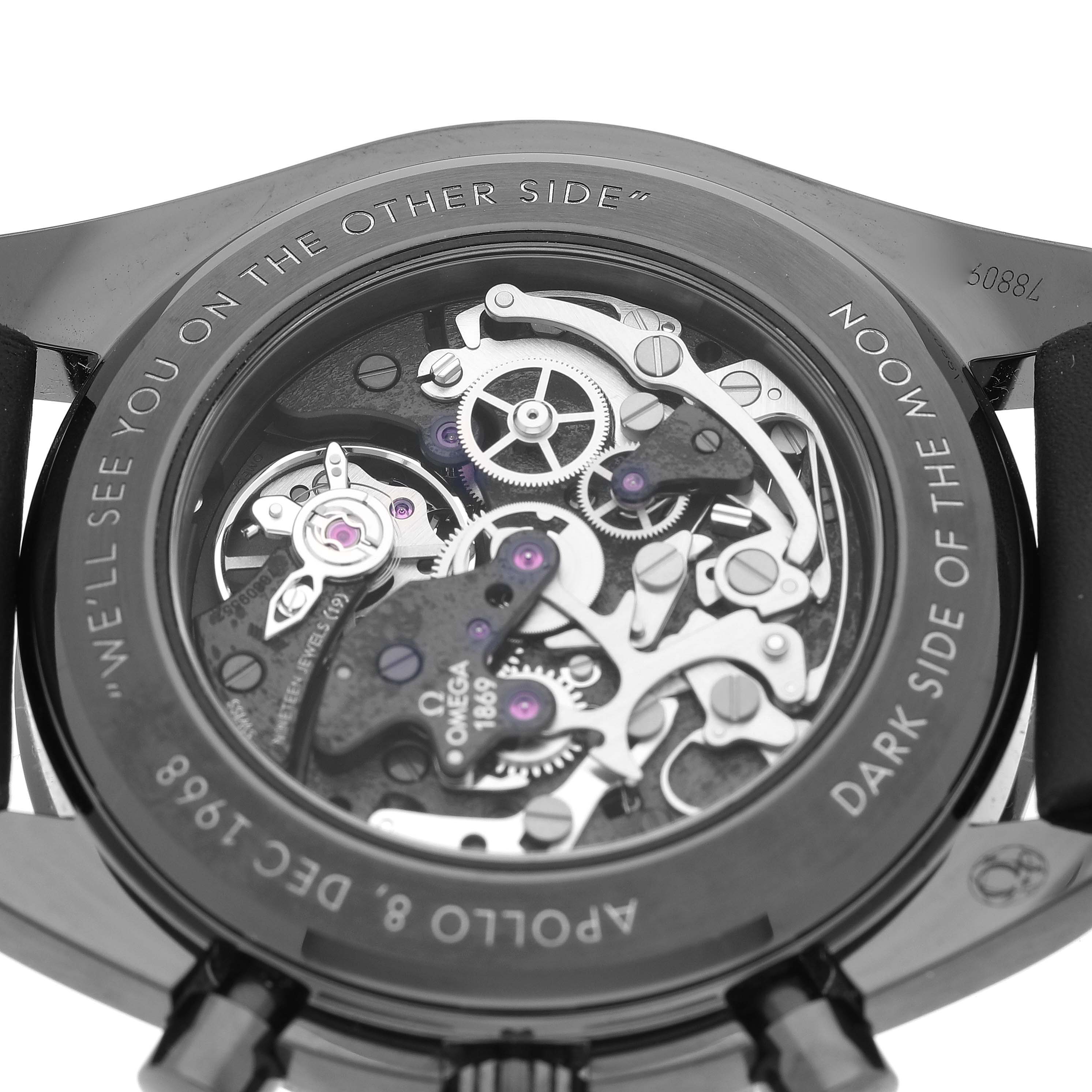 The image shows the back of an Omega Speedmaster 311.92.44.30.01.001 Men's Ceramic Black Dial 311.92.44.30.01.001 Men's Ceramic Black Dial watch, highlighting the exposed movement and inner mechanisms.