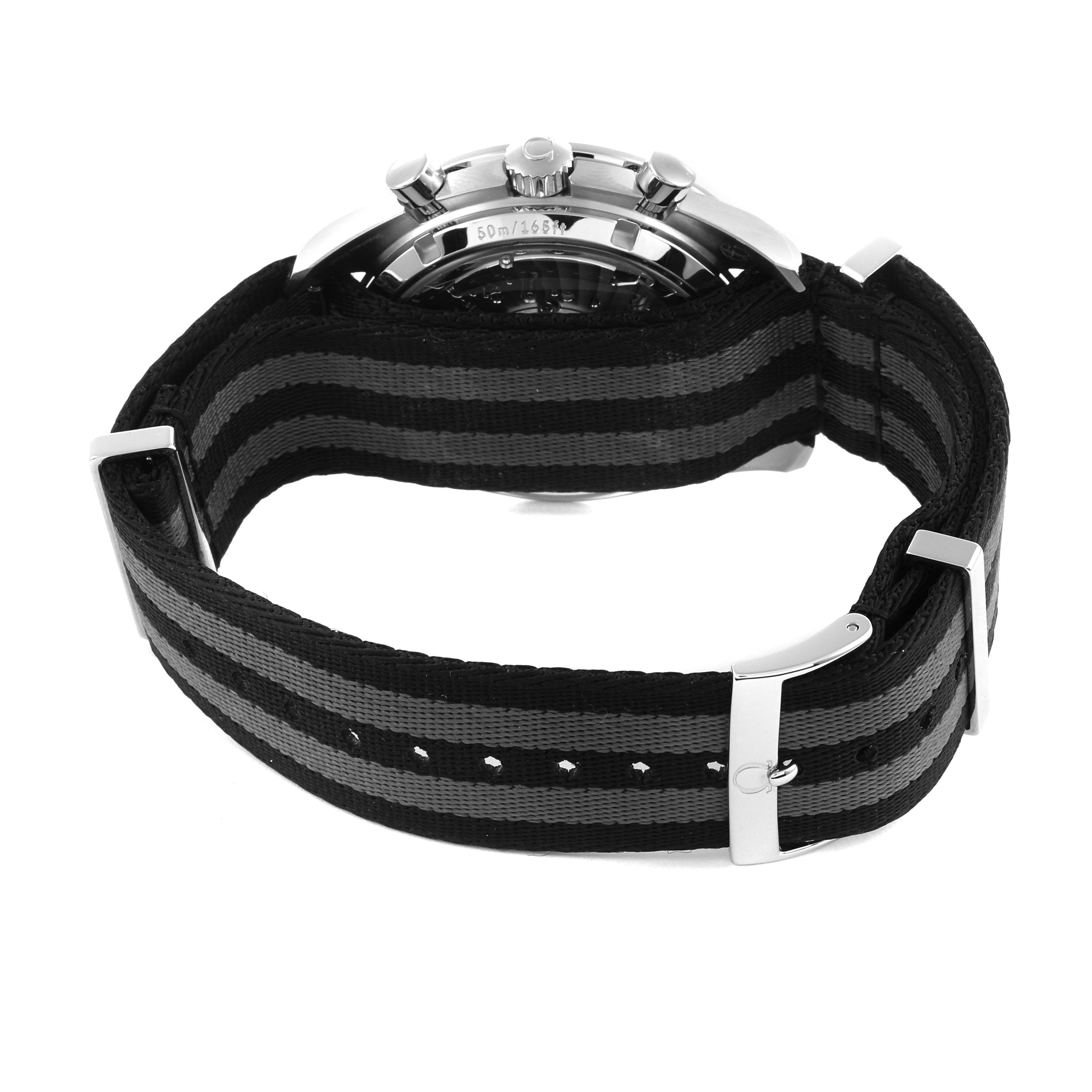 The Omega Speedmaster 329.30.44.51.04.001 Men
s Stainless Steel Silver Dial 329.30.44.51.04.001 Men
s Stainless Steel Silver Dial watch is shown from a rear angle, highlighting the case back and striped fabric strap.