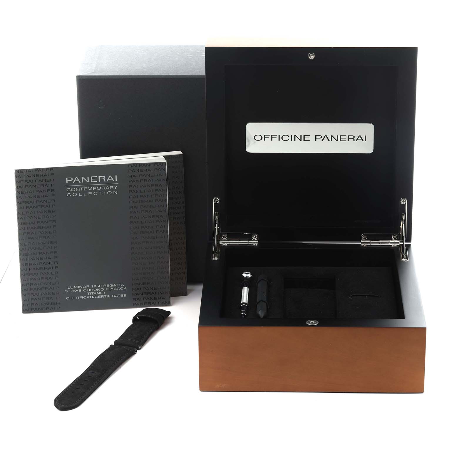 The image shows a Panerai Luminor PAM00526 Men
s Stainless Steel Black Dial PAM00526 Men
s Stainless Steel Black Dial box with a strap, tools, and the manual, viewed from the front and slightly above.