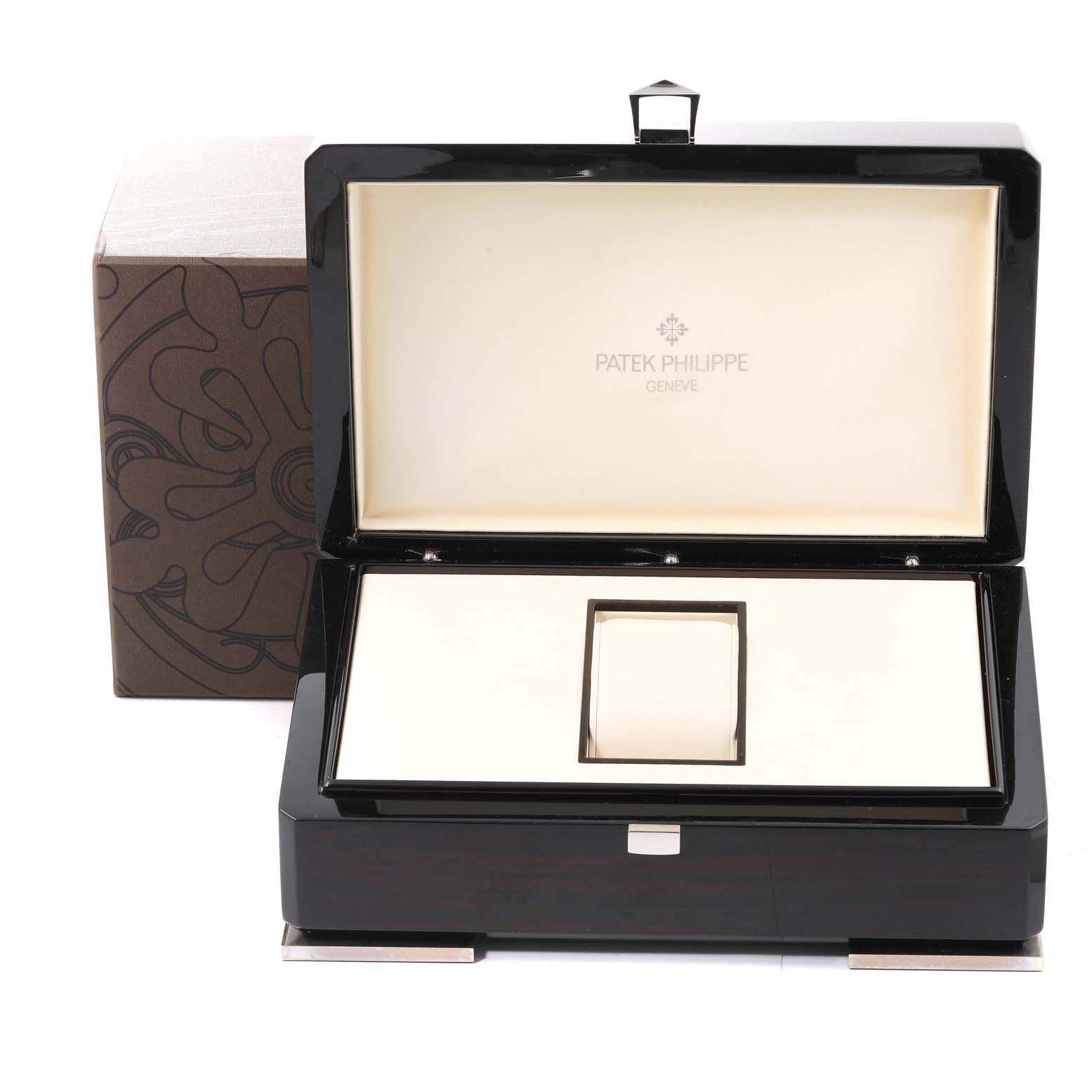 This image shows an open Patek Philippe Aquanaut 5067 Women's Stainless Steel Black Dial 5067 Women's Stainless Steel Black Dial watch box, with the interior and exterior details visible.