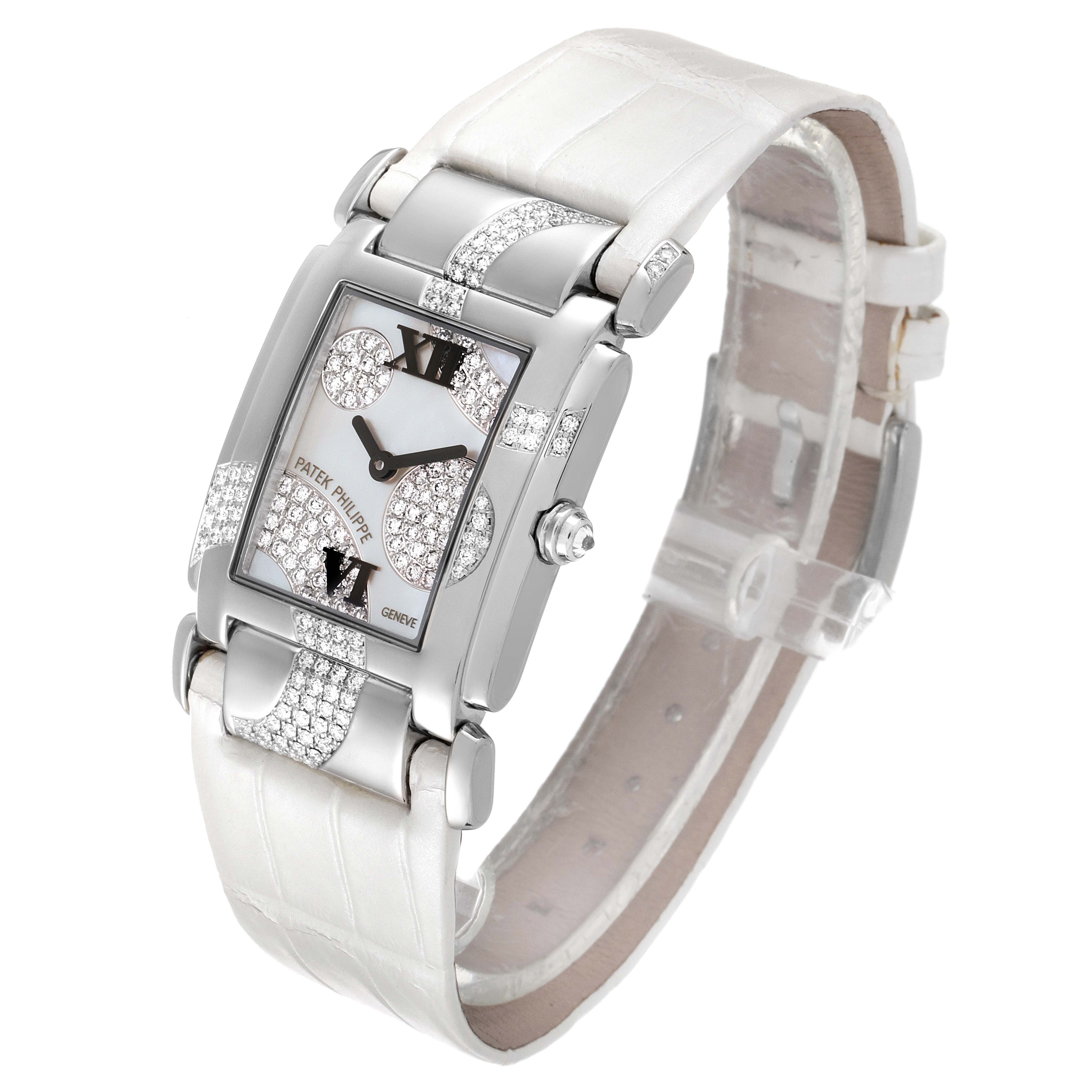 The image shows a Patek Philippe Twenty-4 4914G-001 Women's White Gold Mother of Pearl Dial 4914G-001 Women's White Gold Mother of Pearl Dial watch from a slightly tilted front angle, highlighting its face, strap, and side crown.