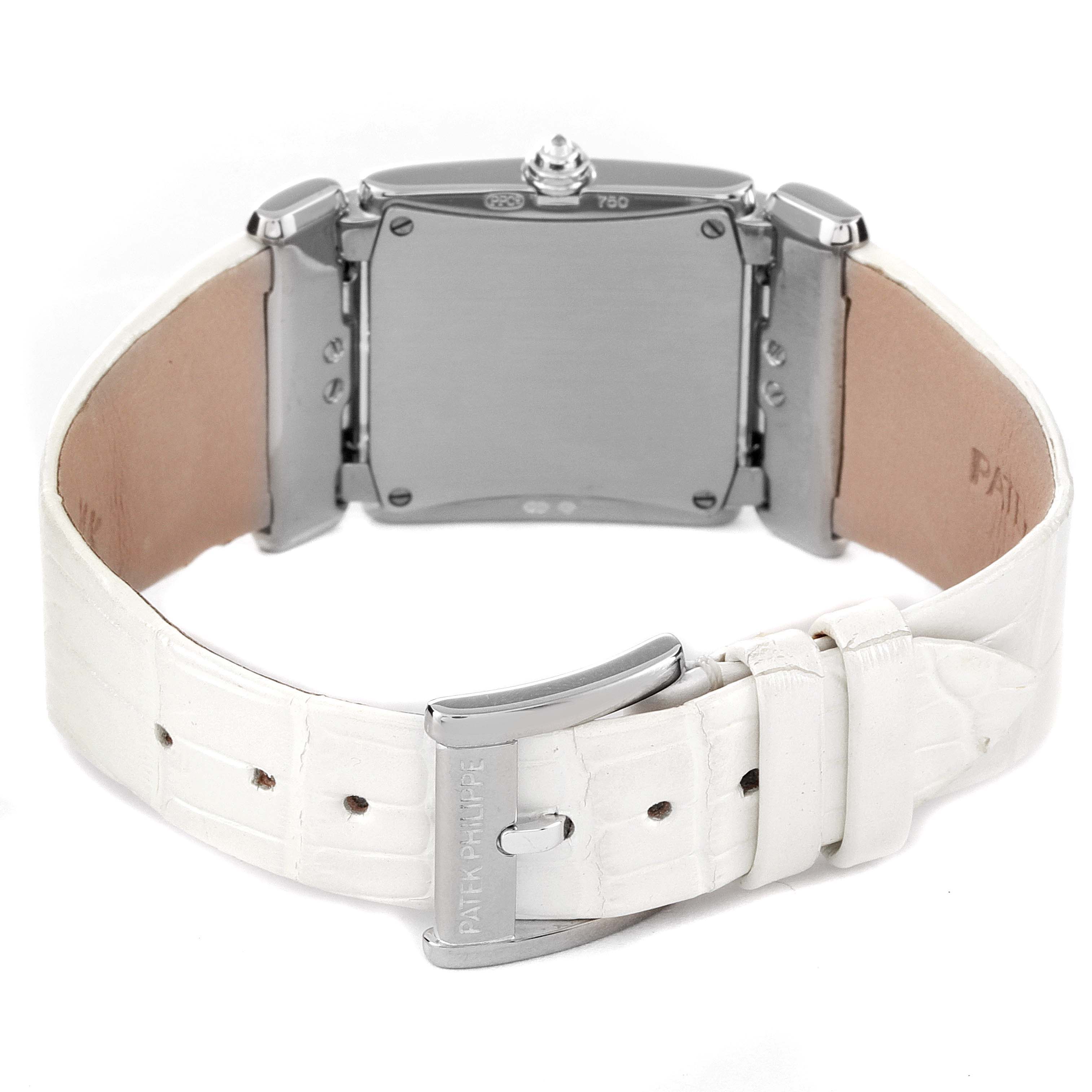 The Patek Philippe Twenty-4 4914G-001 Women's White Gold Mother of Pearl Dial 4914G-001 Women's White Gold Mother of Pearl Dial watch is shown from the back, highlighting its buckle, watch case, and leather strap.