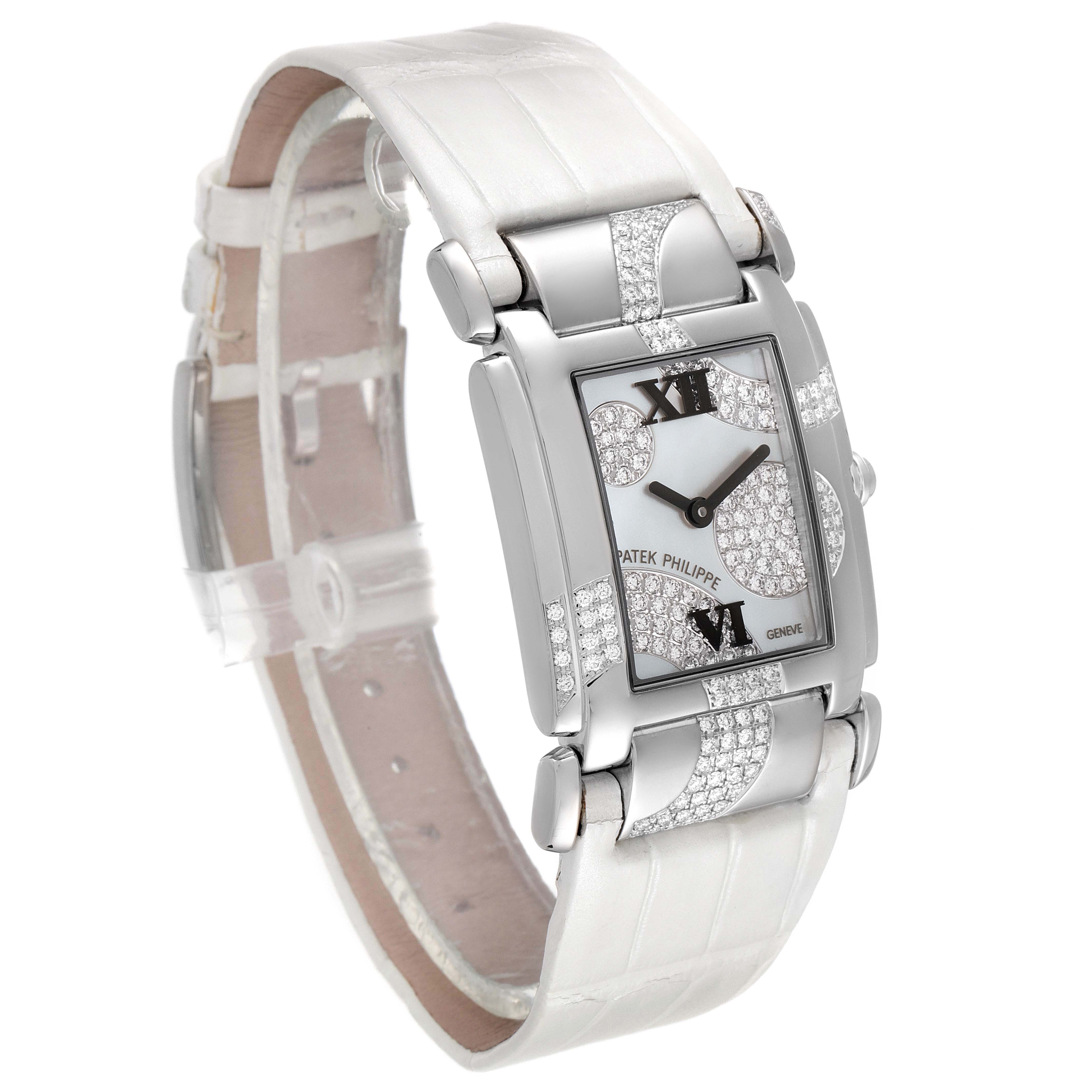 This image shows a side-front angle view of a Patek Philippe Twenty-4 4914G-001 Women's White Gold Mother of Pearl Dial 4914G-001 Women's White Gold Mother of Pearl Dial watch with a diamond-studded bezel and white strap.