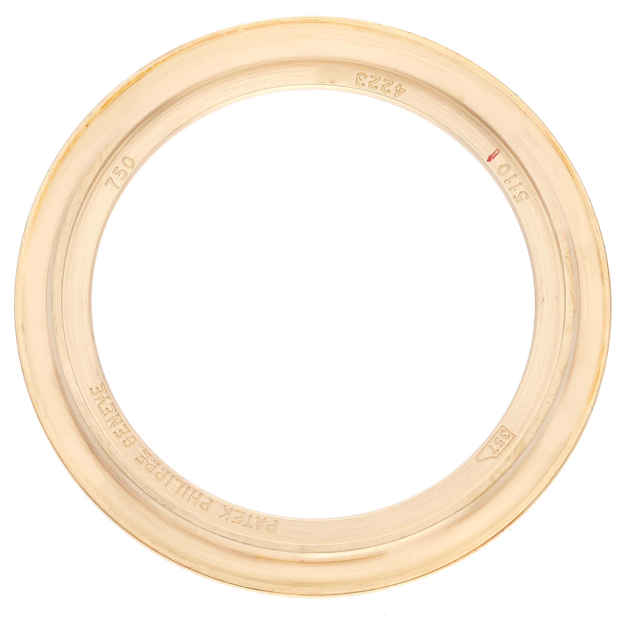 This image shows the bezel of a Patek Philippe Complications 5110J Men's Yellow Gold Silver Dial 5110J Men's Yellow Gold Silver Dial model watch from a top-down angle.