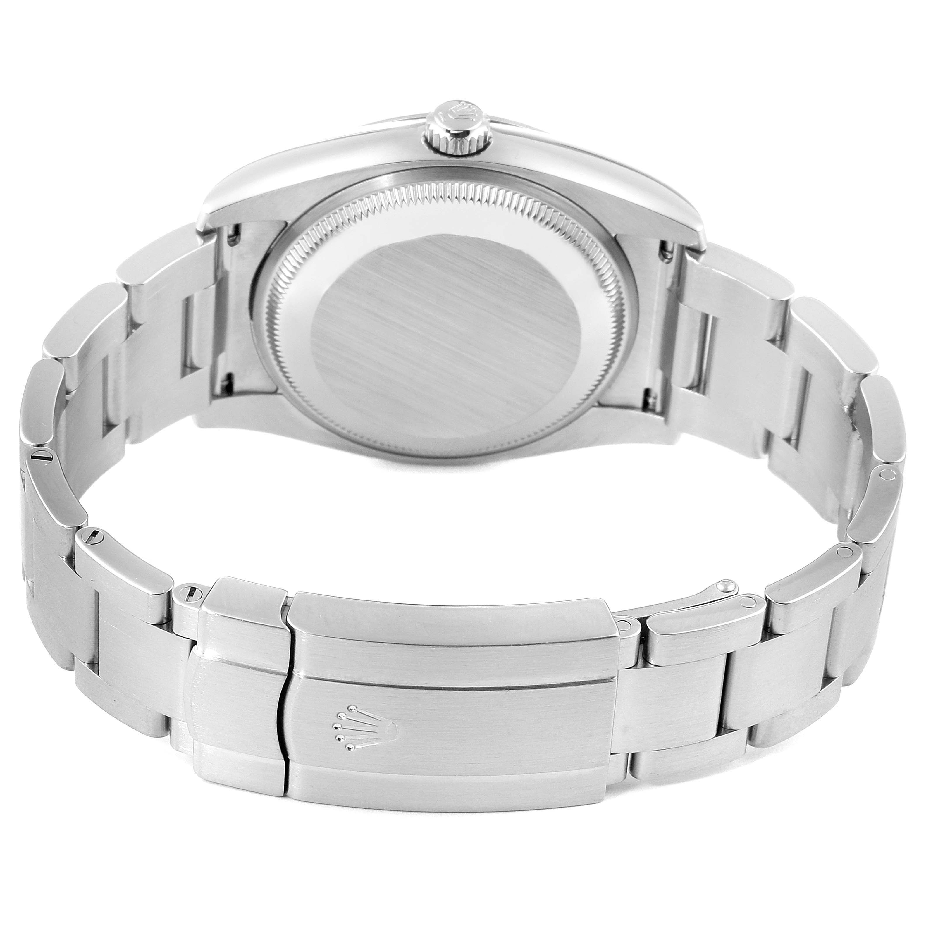 The image shows the back view of a Rolex Air-King 114200 Men's Stainless Steel Silver Dial 114200 Men's Stainless Steel Silver Dial watch, including the case back, crown, and bracelet with the clasp.