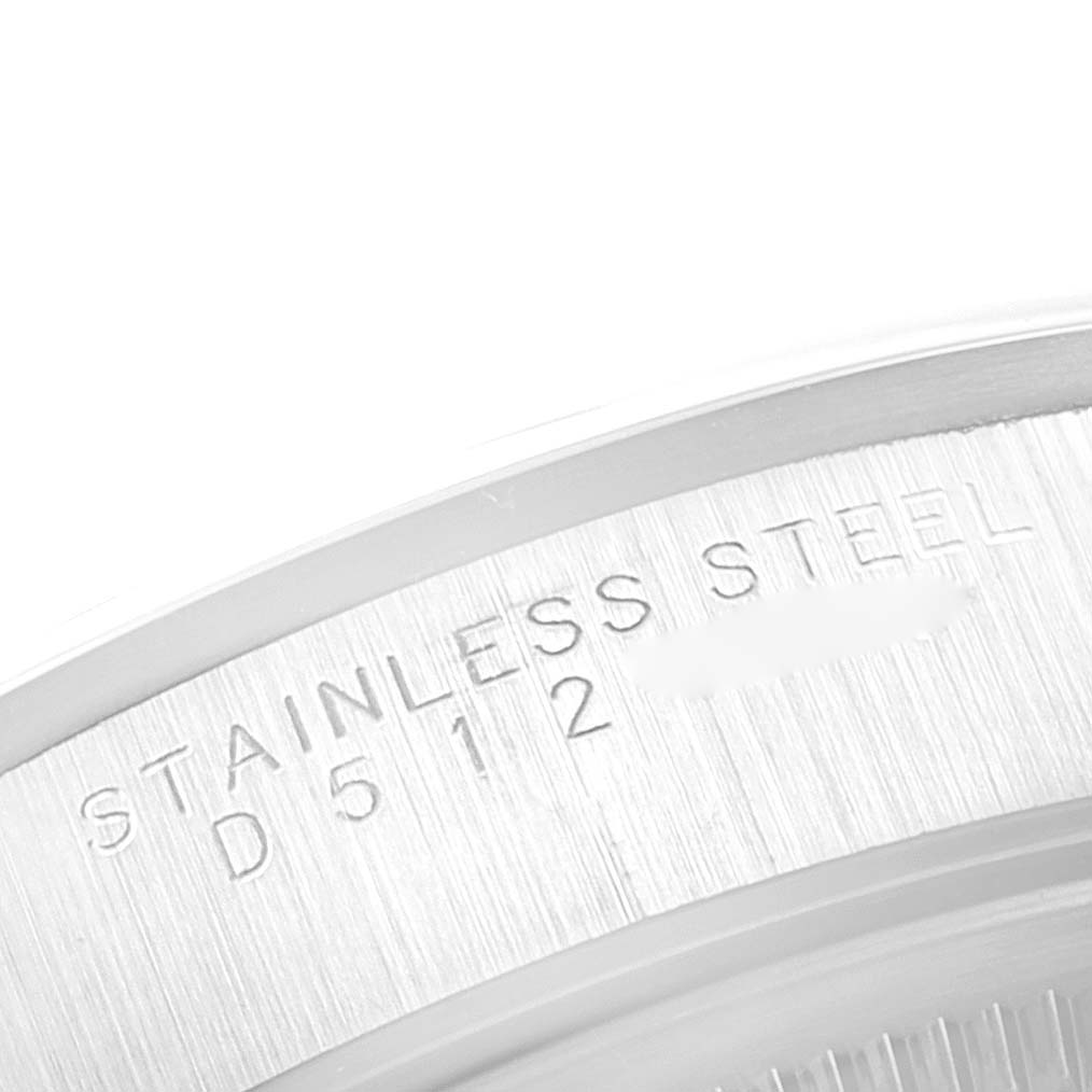 The image shows a close-up of the stainless steel case back of a Rolex Air-King 14000 Men's Stainless Steel Silver Dial 14000 Men's Stainless Steel Silver Dial watch, highlighting its engraved details.