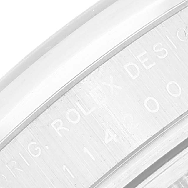 The image shows a close-up view of the engraved inner bezel of the Rolex Air-King 114200 Men's Stainless Steel Grey Dial 114200 Men's Stainless Steel Grey Dial watch.