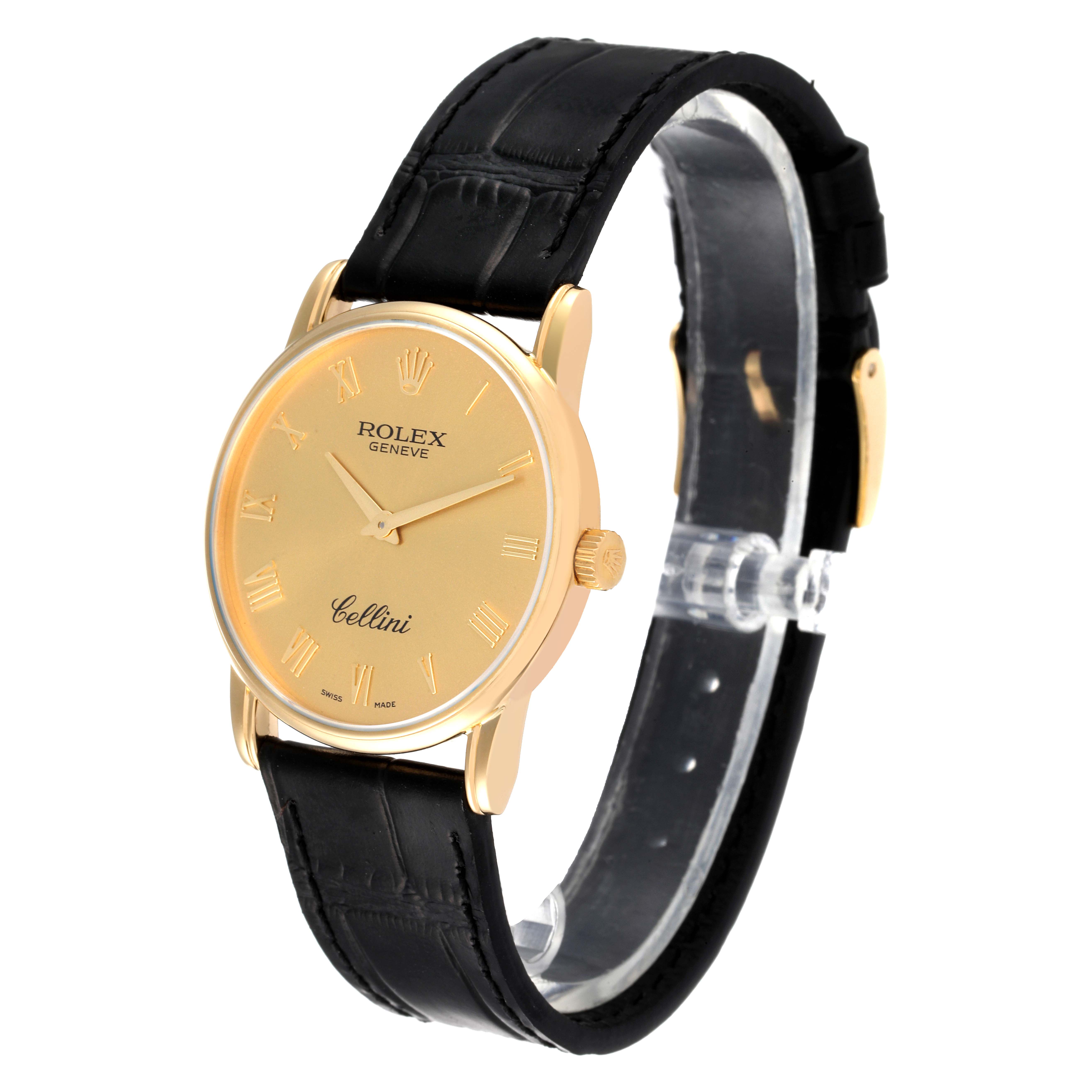 The image shows a Rolex Cellini 5116 Men
s Yellow Gold Champagne Dial 5116 Men
s Yellow Gold Champagne Dial watch from a three-quarter angle, displaying the face, case, and black leather strap.