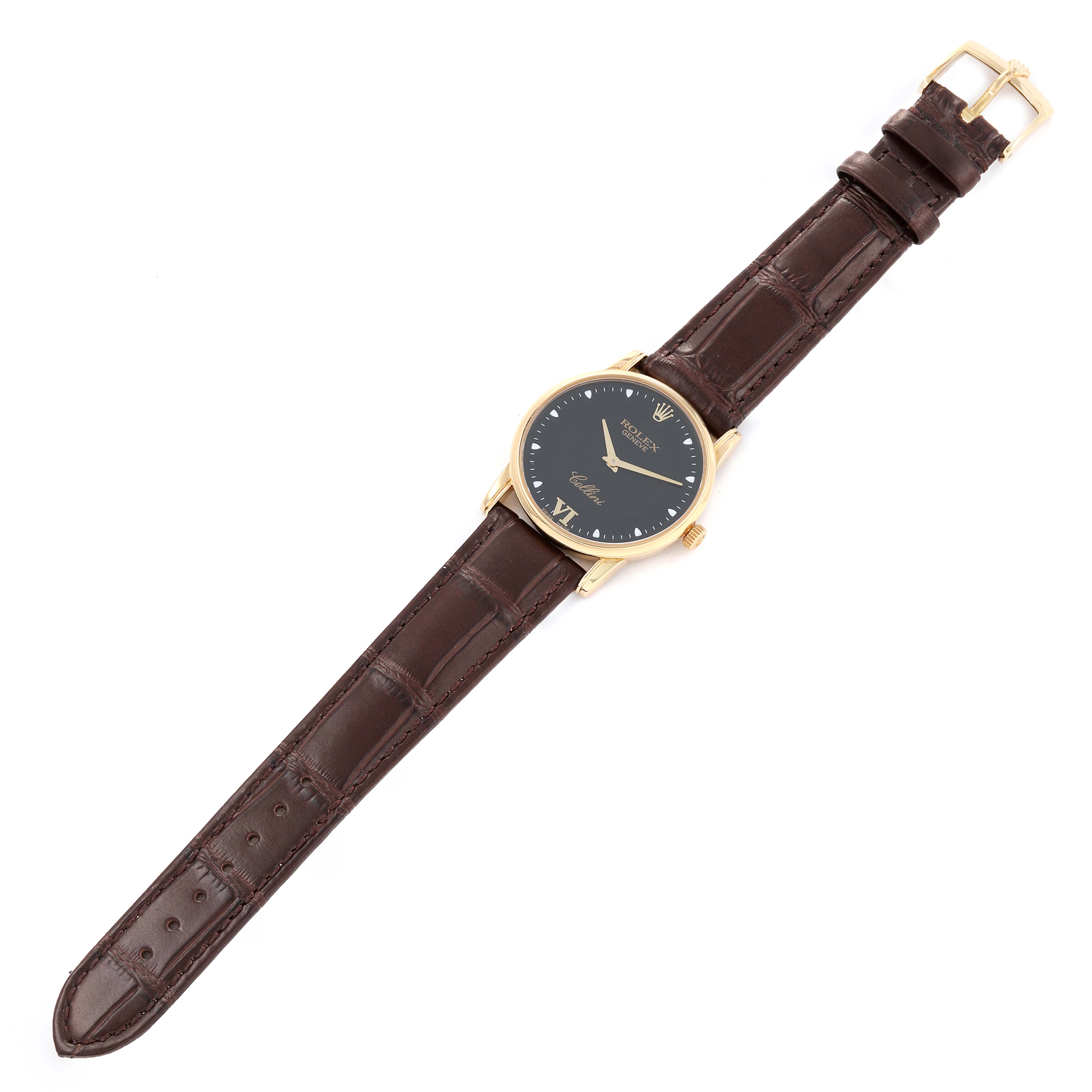The image shows a Rolex Cellini 5116 Men's Yellow Gold Black Dial 5116 Men's Yellow Gold Black Dial watch, laying flat, with a black dial, gold case, and brown leather strap.