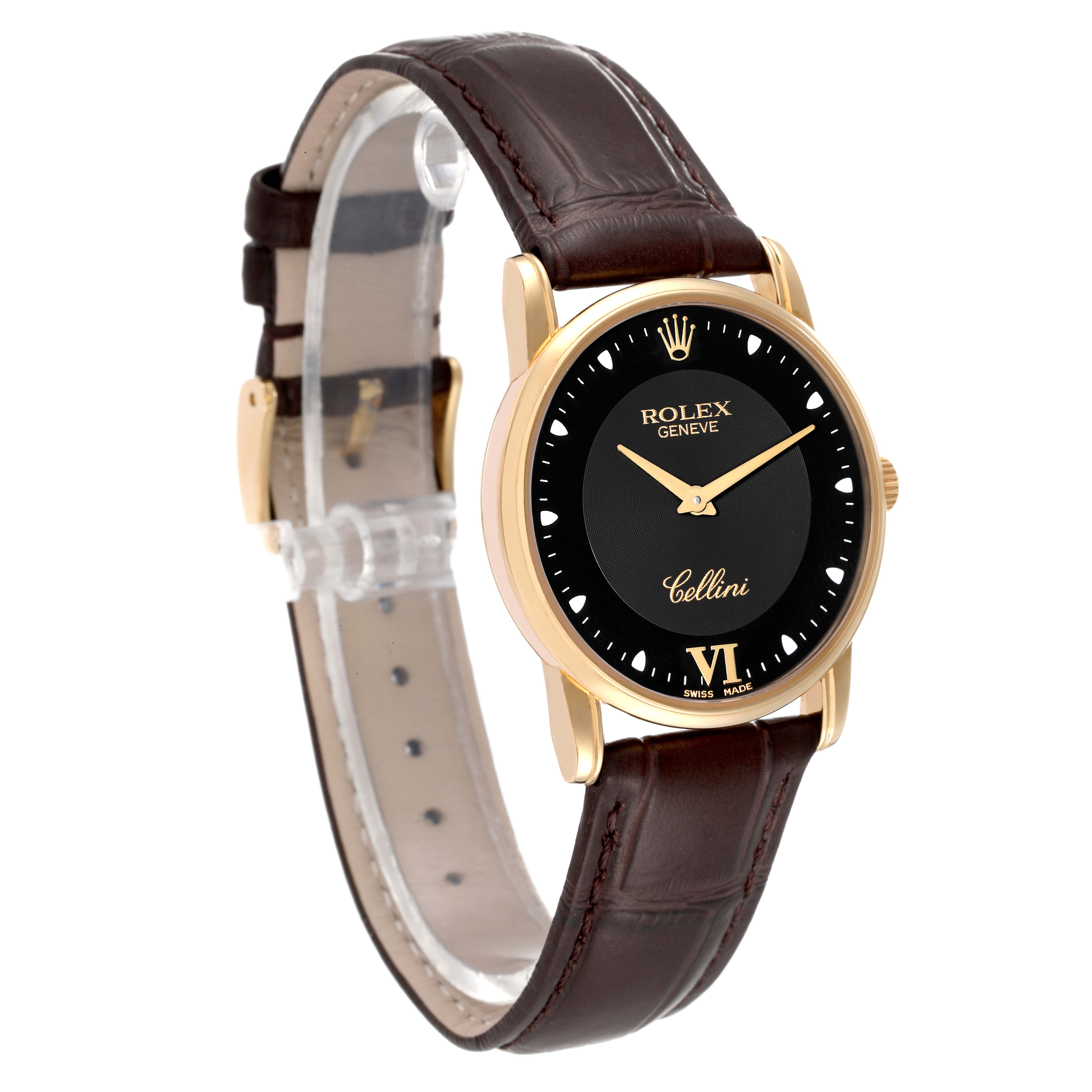 This Cellini model by Rolex is shown at a three-quarter angle, displaying the watch face, leather band, and gold bezel.