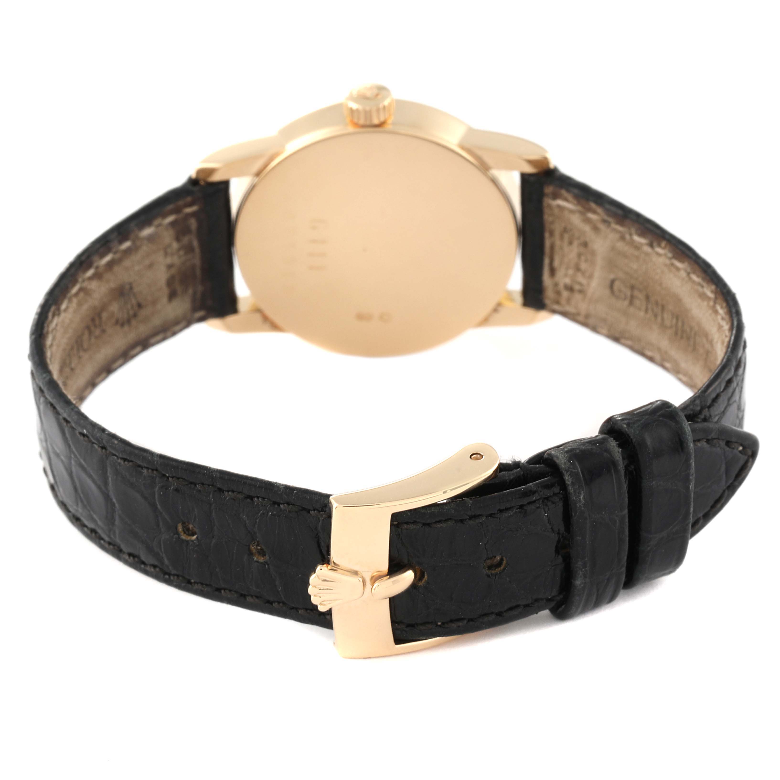 The image shows the back view of a Rolex Cellini 6111 Women's Yellow Gold Grey Dial 6111 Women's Yellow Gold Grey Dial watch, highlighting the case and black leather strap with a clasp.