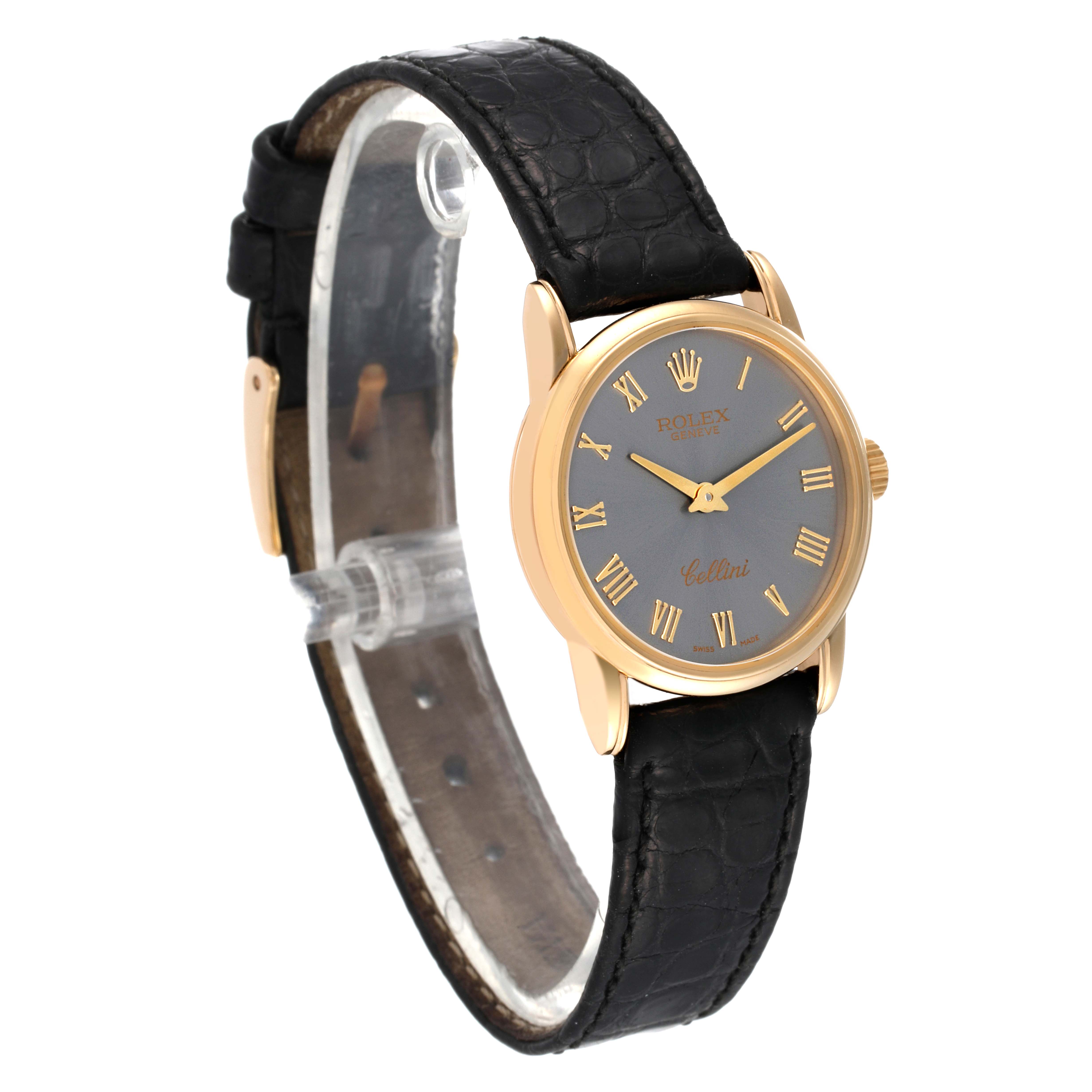 The image shows a Rolex Cellini 6111 Women's Yellow Gold Grey Dial 6111 Women's Yellow Gold Grey Dial watch at a slight angle, featuring its dial, gold case, and black leather strap.