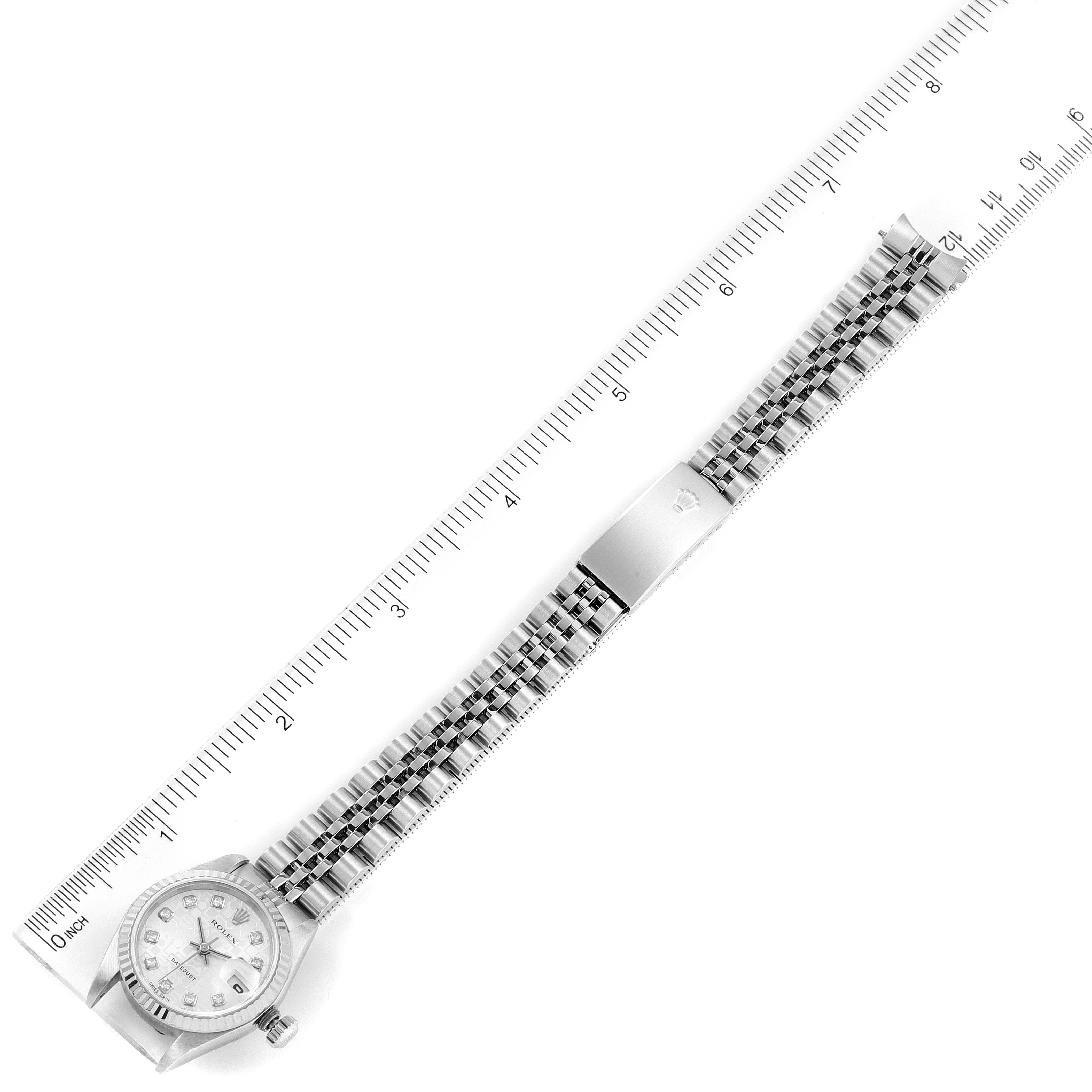 The image shows a top-down view of the Rolex Datejust 79174 Women's Stainless Steel Silver Dial 79174 Women's Stainless Steel Silver Dial watch with a full view of its bracelet stretched out.
