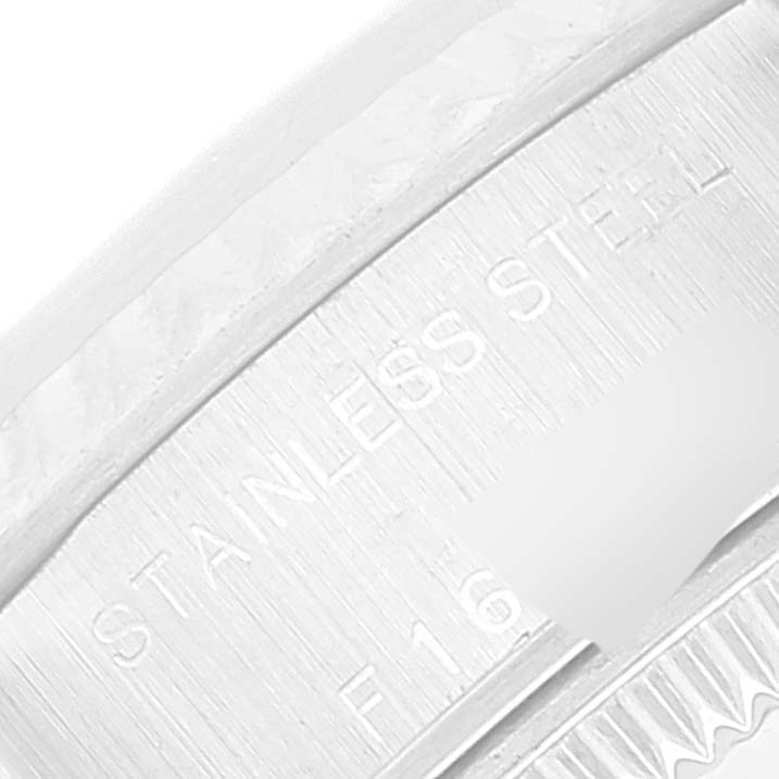 This is a close-up angle of the side of a Rolex Datejust 79174 Women's Stainless Steel Silver Dial 79174 Women's Stainless Steel Silver Dial watch case, showing the "Stainless Steel" engraving.