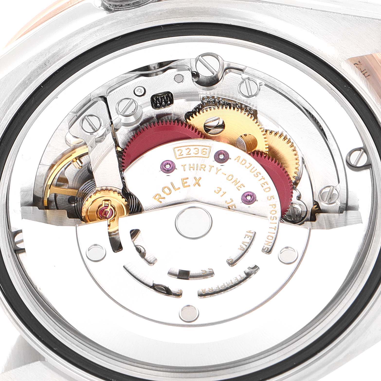 This is a close-up view of the inner mechanical movement of a Rolex Mid-Size 278381 Women
s Steel and Gold (two tone) Silver Dial 278381 Women
s Steel and Gold (two tone) Silver Dial watch, showcasing various gears and components.