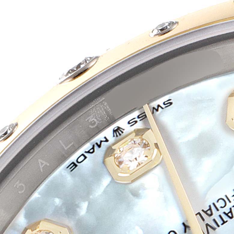 The image shows a close-up of the dial and bezel of a Mid-Size Rolex watch, highlighting the diamond hour markers and "Swiss Made" text.