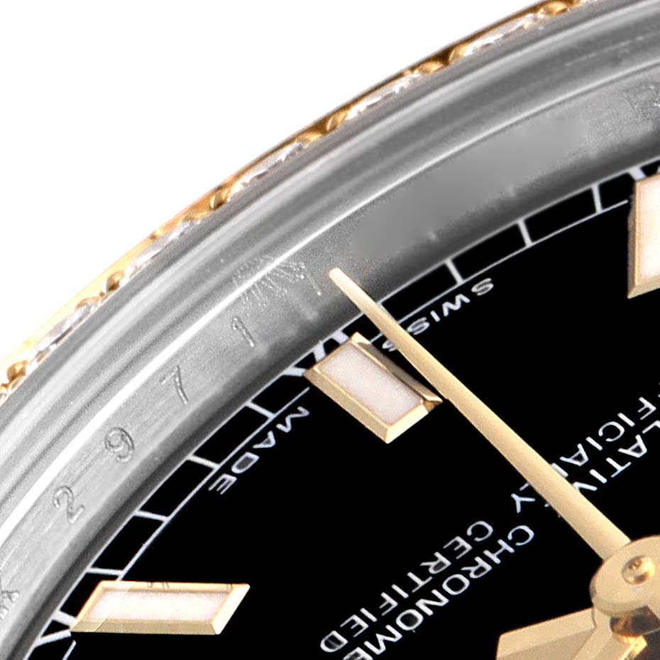 This close-up image of the Rolex Mid-Size 178383 Women
s Steel and Gold (two tone) Black Dial 178383 Women
s Steel and Gold (two tone) Black Dial watch shows part of the dial, hour markers, and the bezel edge at an angled view.