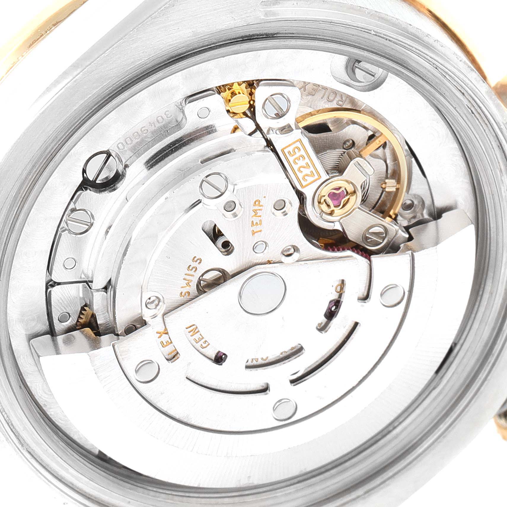 The image shows the internal mechanism and movement of a mid-size Rolex watch viewed from the back.