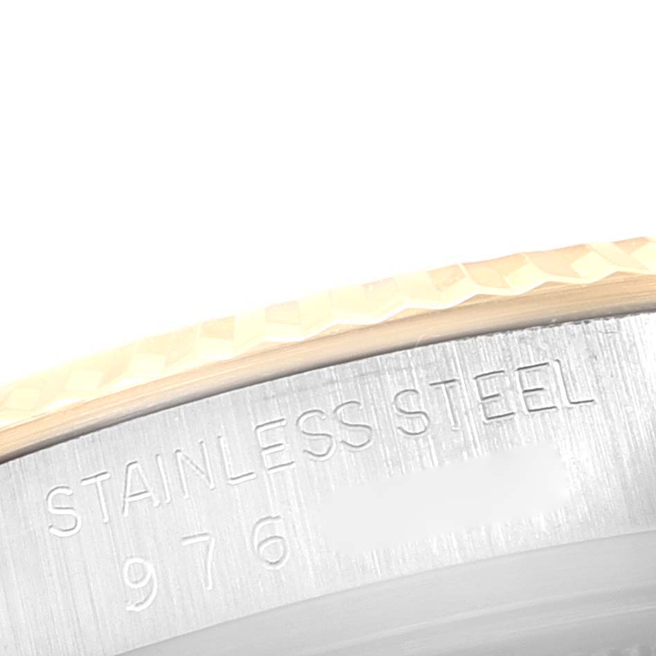 This image shows a close-up angle of the bezel and the stainless steel case back engraving of the Rolex Vintage Collection 16013 Men's Steel and Gold (two tone) Champagne Dial 16013 Men's Steel and Gold (two tone) Champagne Dial watch.
