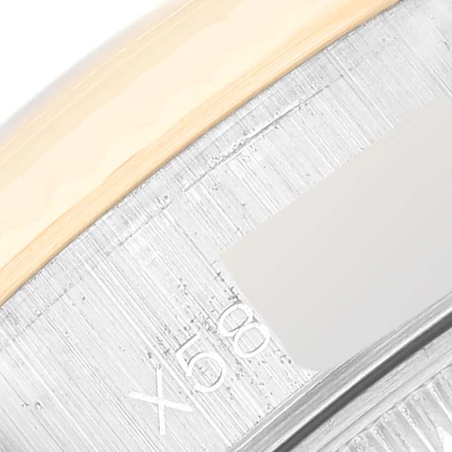 The image shows a close-up of the Rolex Datejust 69173 Women's Steel and Gold (two tone) Black Dial 69173 Women's Steel and Gold (two tone) Black Dial watch, focusing on part of the flange and the inside edge of the bezel.