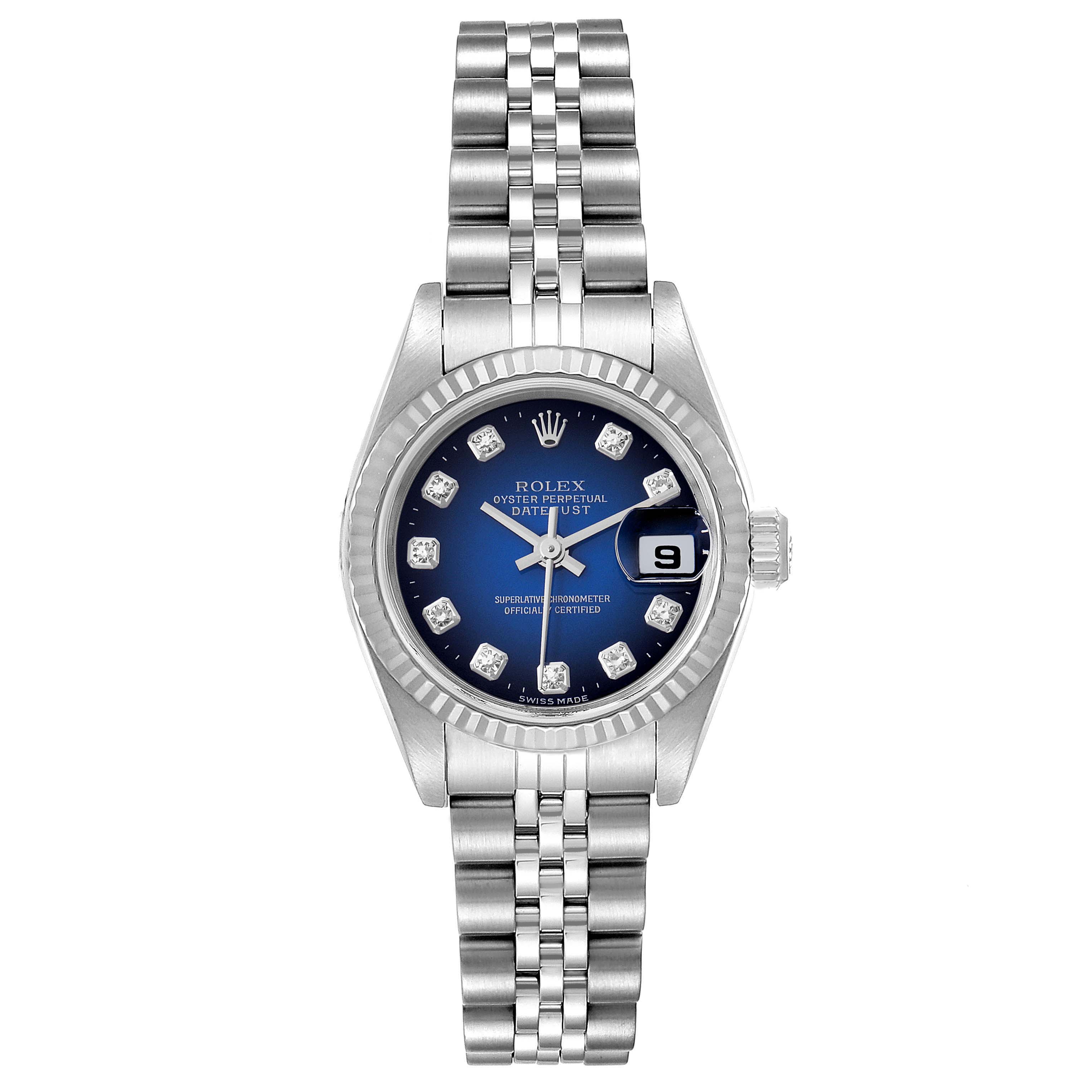 The image shows a front view of a Rolex Datejust 79174 Women's Stainless Steel Blue Dial 79174 Women's Stainless Steel Blue Dial watch, featuring a blue dial with diamond hour markers, a date window, and a silver bracelet.