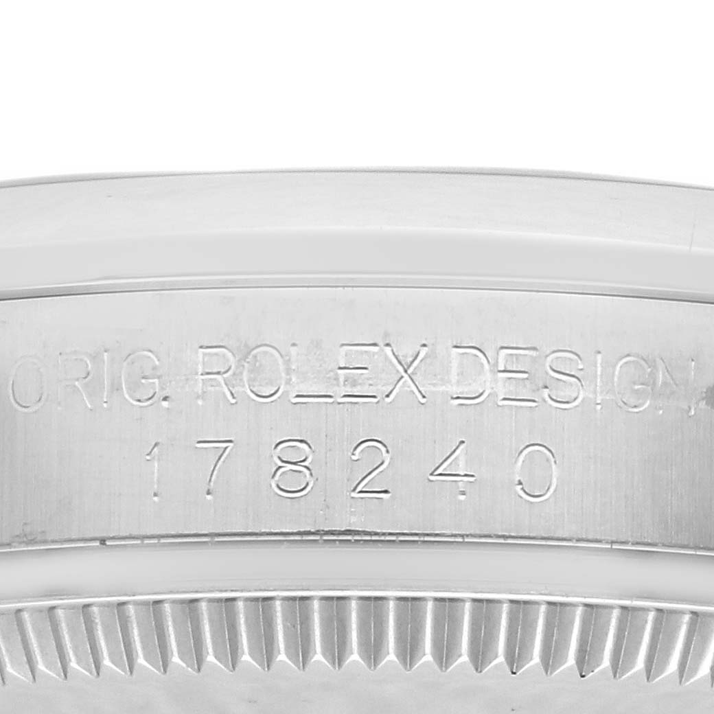 The image shows the side of a Rolex Mid-Size 178240 Women's Stainless Steel Blue Dial 178240 Women's Stainless Steel Blue Dial model with engraved design and model number.