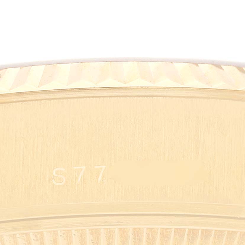 The image shows a close-up of the bezel and part of the case of a Rolex President 69178G Women's Yellow Gold Champagne Dial 69178G Women's Yellow Gold Champagne Dial model watch.