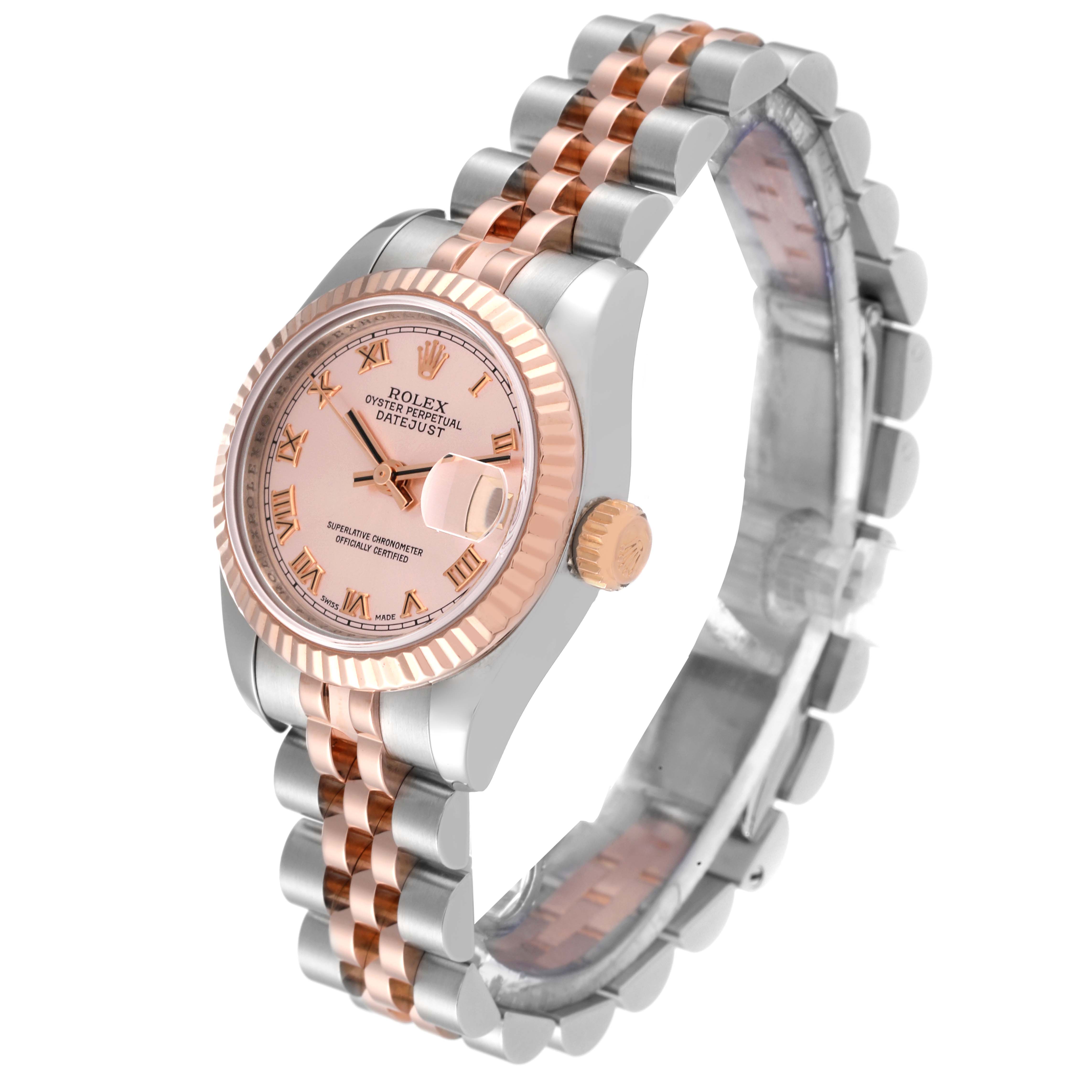 The image shows a Rolex Datejust 179171 Women's Steel and Gold (two tone) Pink Dial 179171 Women's Steel and Gold (two tone) Pink Dial model watch at a three-quarter angle, highlighting its face, crown, and two-tone bracelet.