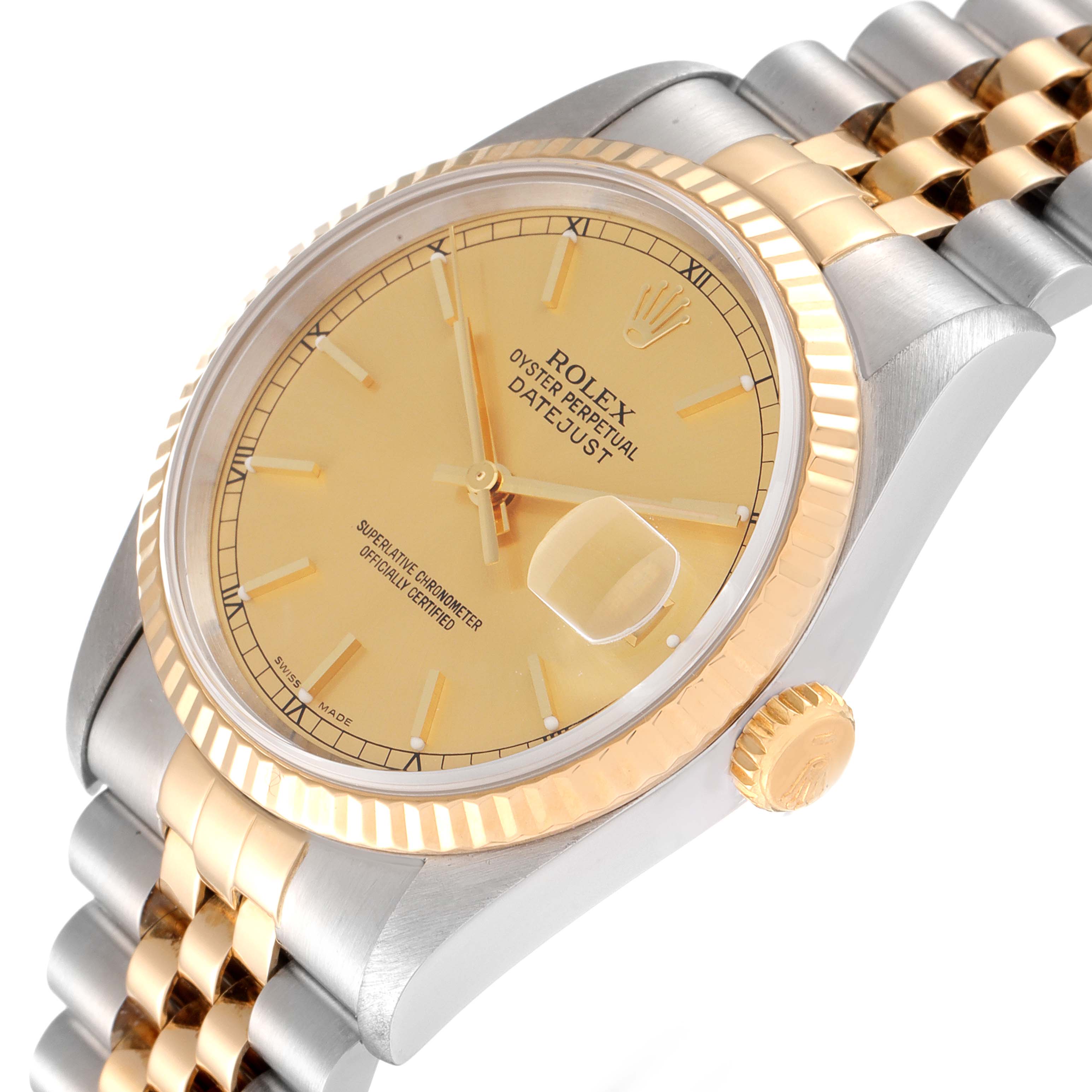 This image shows a close-up angled view of the Rolex Datejust 16233 Men's Steel and Gold (two tone) Champagne Dial 16233 Men's Steel and Gold (two tone) Champagne Dial's dial, fluted bezel, crown, and part of the jubilee bracelet.