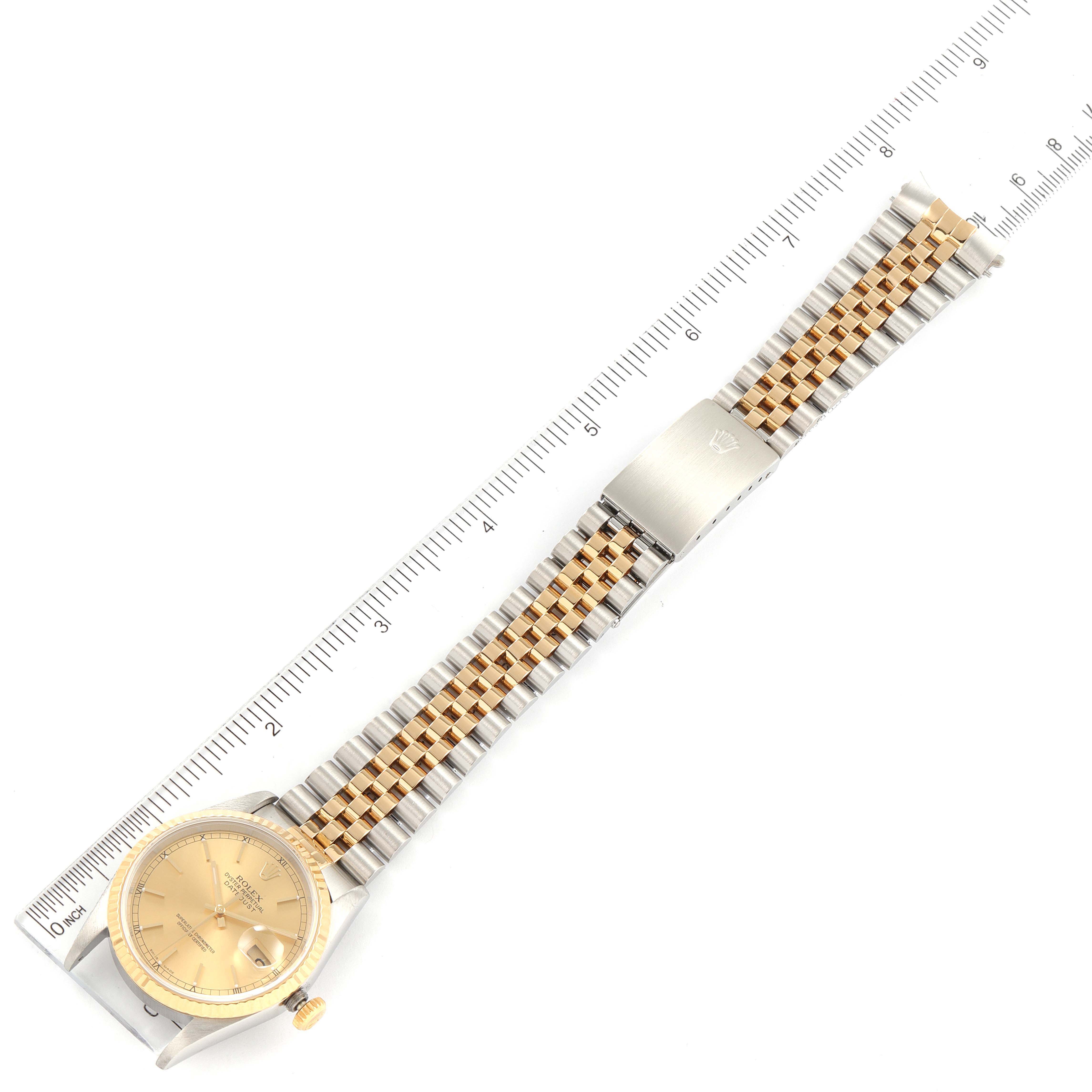 This image shows a Rolex Datejust 16233 Men's Steel and Gold (two tone) Champagne Dial 16233 Men's Steel and Gold (two tone) Champagne Dial watch laid flat, displaying the face, bezel, and full bracelet with ruler measurements.