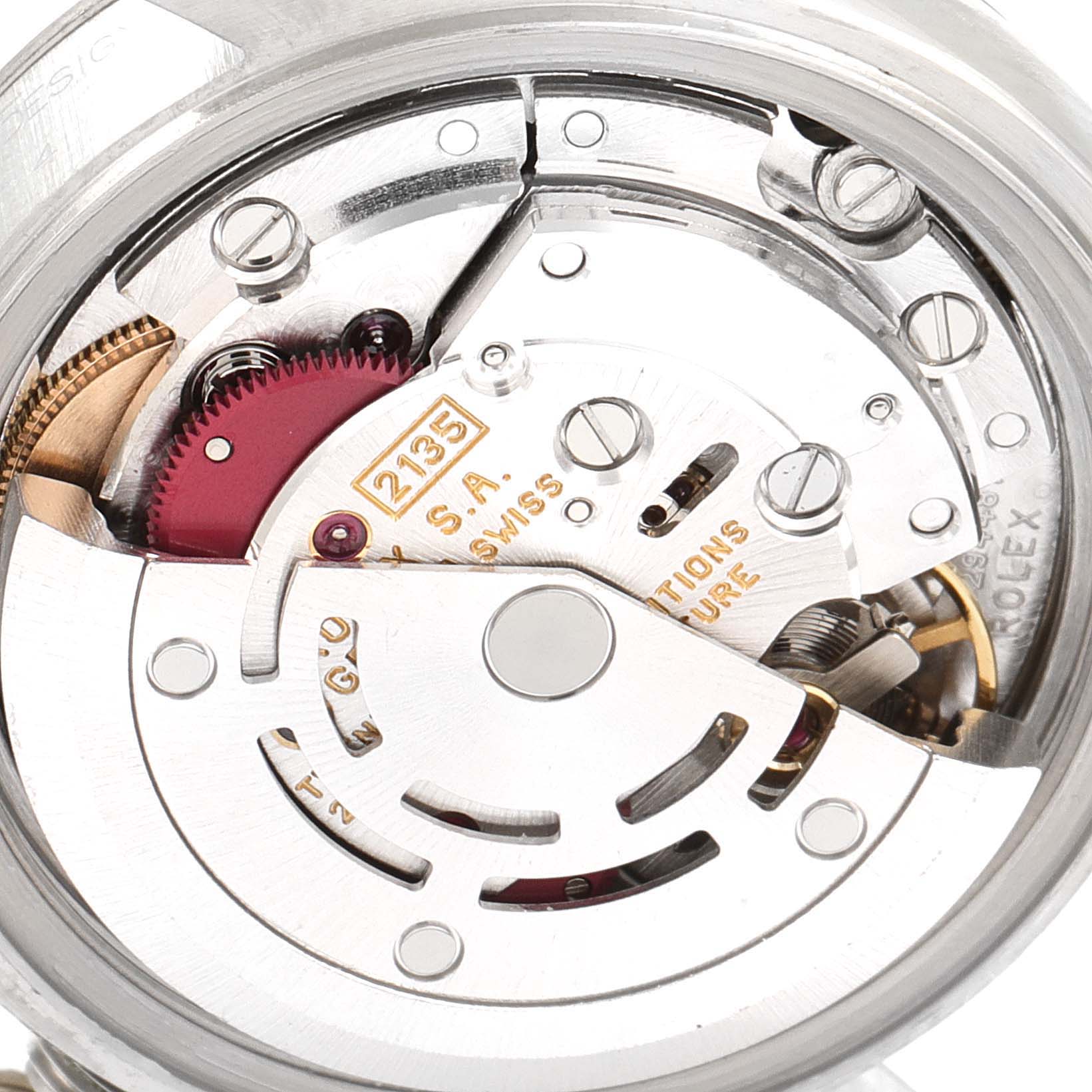 The image shows a close-up of the Rolex Datejust 69174 Women
s Stainless Steel Silver Dial 69174 Women
s Stainless Steel Silver Dial watch movement and internal mechanism.