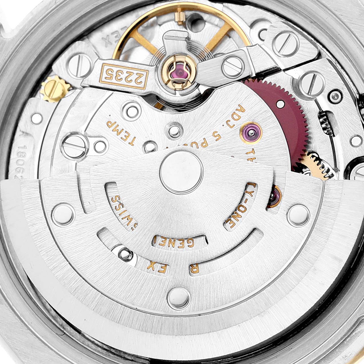 This image shows a close-up view of the Rolex Datejust 179173G Women's Steel and Gold (two tone) Silver Dial 179173G Women's Steel and Gold (two tone) Silver Dial movement, highlighting intricate components like the rotor, gears, and jewels.