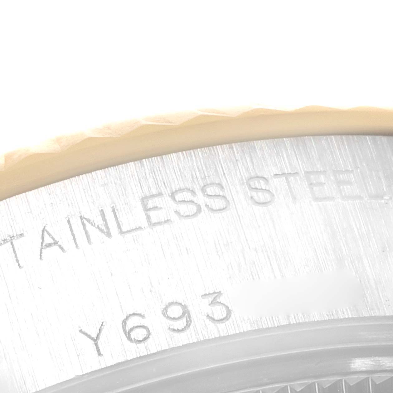 This image shows a close-up of the outer rim of the case back with engravings on a Rolex Datejust 79173 Women's Steel and Gold (two tone) Champagne Dial 79173 Women's Steel and Gold (two tone) Champagne Dial watch.